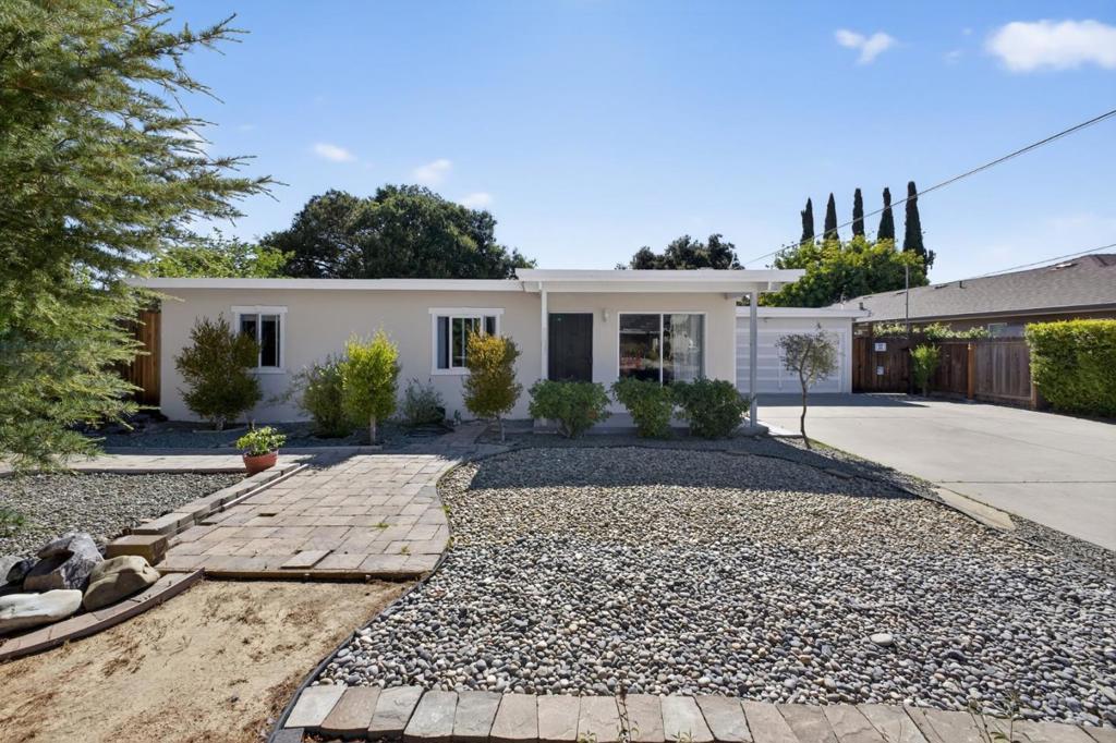 Welcome to 848 Kenneth Avenue - A unique location nestled in a highly desirable Campbell San Tomas neighborhood! This charming residence presents an exceptional opportunity for those seeking a versatile property. Whether you prefer to move in & enjoy as is, expand the existing structure or add an ADU for additional income, this 9,825 sqft lot offers provides endless potential to create your ideal living space. The home itself exudes a warm & inviting atmosphere w/ open beam ceilings, vibrant hardwood floor & a cozy living room w/ a fireplace & skylight that fills the space with natural light. The well-equipped kitchen features ample cabinetry, full suite of appliances & a waterfront view from the window. Down the hall, you'll find an updated guest bath & spacious bdrms, including one w/ direct access to the backyard. Step outside to the expansive yard w/ multiple patios, a workshop shed, a flexible studio space & waterfront access w/ no neighbors directly behind you! Enjoy the amenities of an att'd 2 car garage, extra large driveway & prime location near the Los Gatos border. Close to Bay Club Courtside, Los Gatos Creek Trail, Downtown Campbell, the Farmers Market, Pruneyard Shopping Center, and Hwys 17/85/280. Great Schools: Capri Elem., Rolling Hills Middle, and Westmont High.