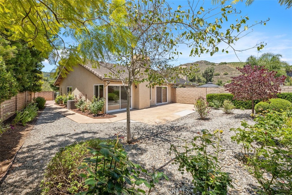 Nestled within the highly sought-after Pala Mesa Fairway Villas, this beautifully updated two-bedroom, two-bathroom home offers an exceptional blend of comfort and sophistication. Step inside to a thoughtfully designed open-concept layout, featuring high ceilings, ceiling fans throughout, a bright, airy interior, and a fireplace enhancing the home’s inviting atmosphere. The redesigned kitchen is equipped with soft-close cabinetry, a refrigerator, dishwasher, microwave, and a five-burner gas range, all designed to combine style with functionality. Ample storage is provided by two spacious hallway closets in addition to the built-in hallway storage. The bathrooms have a modern feel and both bedrooms are generously sized, featuring custom-built closet designs. The primary suite offers the luxury of direct outdoor access through a walk-out sliding glass door, seamlessly integrating indoor and outdoor living. Outside, this home is fully fenced with private courtyards, professionally landscaped with an automated sprinkler system, and showcases a spacious back patio overlooking the Pala Mesa Golf Course—an idyllic setting to enjoy the year-round temperate climate.
While not enjoying your private space, you can take advantage of the Community’s beautifully manicured grounds, two sparkling pools, and three relaxing spas. The home is also equipped with solar panels, rain gutters, and newer energy-efficient windows. Additional features include a two-car garage outfitted with upper storage, built-in cabinetry, and an automatic garage door opener. With serene golf course views and peek-a-boo glimpses of the surrounding mountains, this home offers tranquility and scenic beauty while maintaining easy accessibility. Located near Interstate 15 and Highway 76, it provides convenient access to the best of San Diego County, Temecula Wine Country, and beyond.