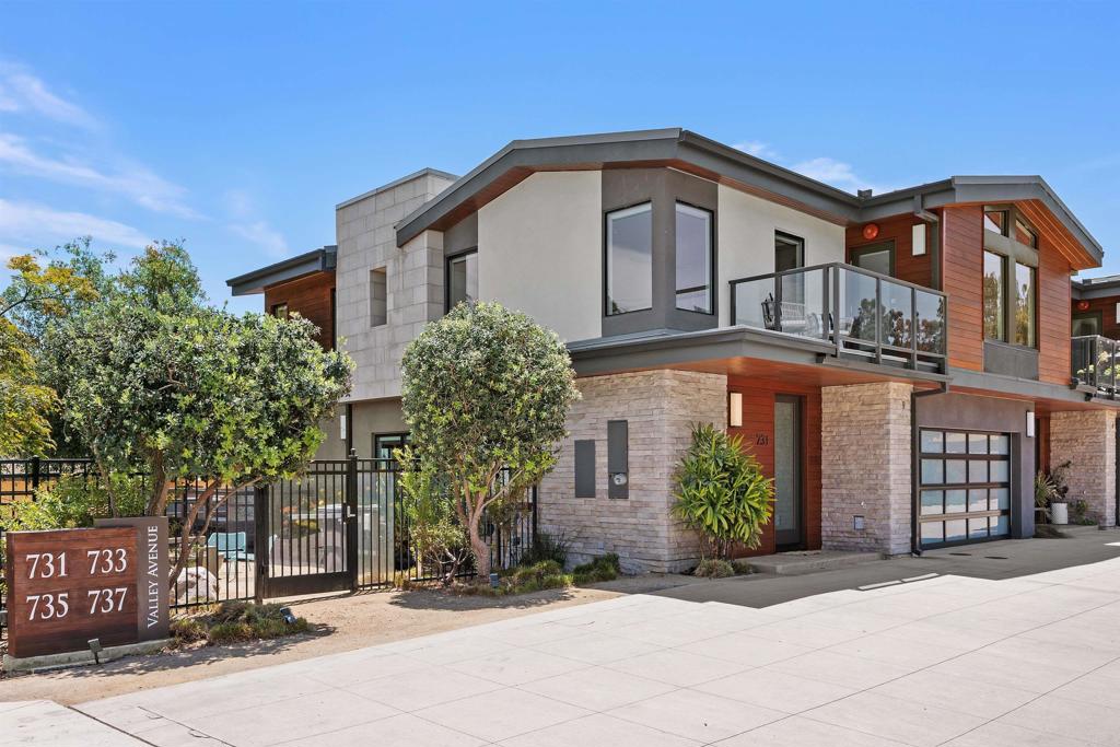 Nestled in one of the few remaining areas of SOLANA BEACH undergoing exciting revitalization, this is a unique opportunity to be part of a vibrant and growing community. As thoughtful development continues to enhance the neighborhood, interest and demand are on the rise. Now is the perfect time to own a home where lifestyle, location, and long-term value come together! The Residences at Solana Beach is a limited collection of four luxury townhomes located west of I-5, just steps from La Colonia Park—Amenities include a pickleball court and skate park—award-winning elementary and middle schools, the Del Mar Racetrack and DOG BEACH as well as the vibrant Cedros Design District, known for its shops and eateries. Built in 2018, this contemporary home features an open-concept floor plan designed for seamless indoor-outdoor living. Expansive folding doors lead to a spacious covered patio and three private balconies, perfect for entertaining or relaxing. The custom European kitchen offers soft-close cabinetry, waterfall countertops, and GE Café appliances. Bathrooms feature Carrara tile and Restoration Hardware vanities. Additional highlights include: Whole-home automated window coverings for effortless light and privacy control, an upgraded two-car garage with stained concrete floors and EV charging capabilities. A shared community terrace with a fire pit and lounge area completes this coastal living experience—an ideal blend of comfort, design, and location in the heart of Solana Beach.