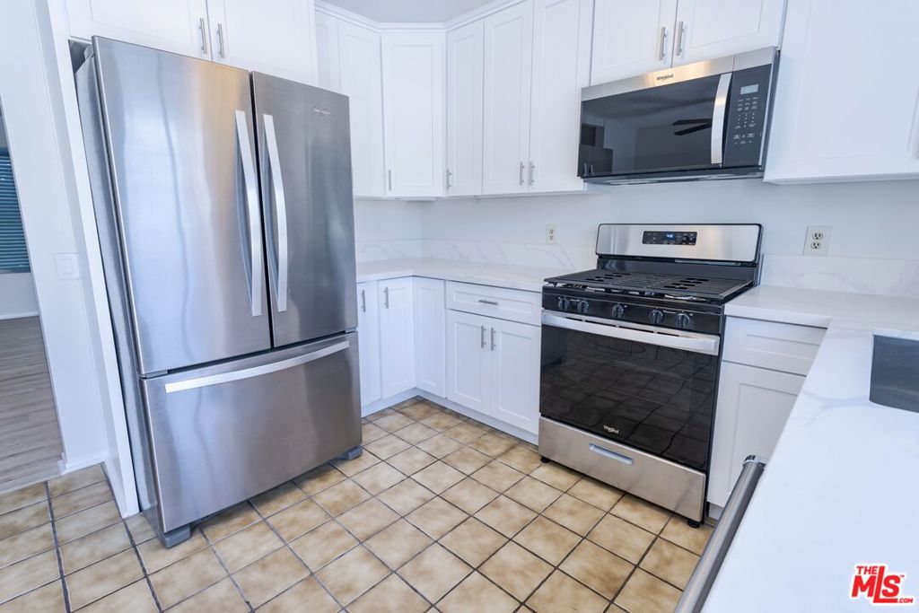 ***Located in a prime Irvine location***, this beautifully updated three-bedroom lower-level with patio condo offers the perfect blend of style, convenience, and resort-style amenities. Situated in the highly sought-after Woodbridge Village, residents enjoy access to over 40 recreational facilities including lakes, lagoons, pools, tennis courts, pickleball, parks, and fishing docks. Inside, you'll find a renovated kitchen and bathroom featuring stainless steel appliances, quartz countertops, sleek cabinetry, and durable LVP flooring all complemented by fresh interior paint. With close proximity to UCI, Irvine Valley College, SNA Airport, Irvine Spectrum, restaurants, and 405 and 5 freeways, this home offers excellent access to education, transportation, and recreation in one of Irvine's most connected communities.