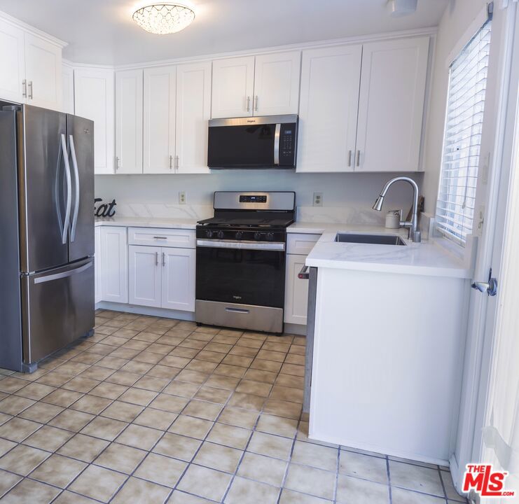 ***Located in a prime Irvine location***, this beautifully updated three-bedroom lower-level with patio condo offers the perfect blend of style, convenience, and resort-style amenities. Situated in the highly sought-after Woodbridge Village, residents enjoy access to over 40 recreational facilities including lakes, lagoons, pools, tennis courts, pickleball, parks, and fishing docks. Inside, you'll find a renovated kitchen and bathroom featuring stainless steel appliances, quartz countertops, sleek cabinetry, and durable LVP flooring all complemented by fresh interior paint. With close proximity to UCI, Irvine Valley College, SNA Airport, Irvine Spectrum, restaurants, and 405 and 5 freeways, this home offers excellent access to education, transportation, and recreation in one of Irvine's most connected communities.