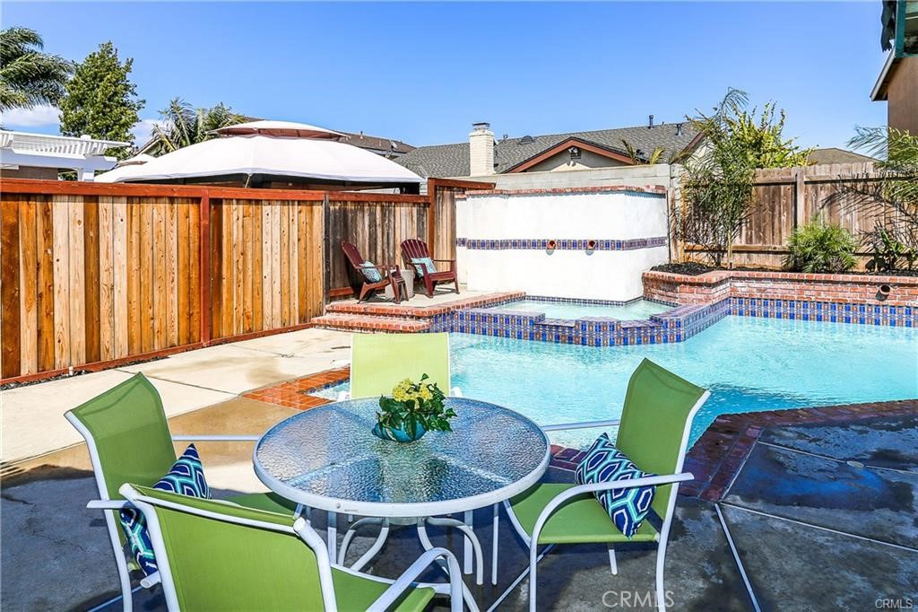 Private Huntington Beach Oasis –3 Bed/2 Bath Single-Story w/ Pool & Spa. Discover your own piece of paradise in the heart of Huntington Beach! This beautifully maintained single-story home offers the perfect blend of tranquility, luxury, & unmatched location. Featuring 3 spacious bedrooms & 2 remodeled bathrooms, the home is nestled in a quiet, safe neighborhood. Step outside & enjoy true resort-style living w/ a sparkling pool & spa complete w/ tranquil water features & newly replastered w/ designer Stonescape mini pebble. The backyard also features multiple seating areas, a pergola-covered patio w/ bistro lights, a convenient server window, w/ patio furniture & BBQ included—perfect for entertaining or relaxing in your own personal paradise enhanced by newer vinyl & wood fencing. Inside, the home welcomes you w/ an open & inviting floor plan filled w/ premium upgrades. Designer terracotta tile flooring throughout the living space while 2 of the bedrooms feature new luxury plank vinyl flooring,& the entire home boasts new interior paint throughout. The home is equipped w/ Solar, Central AC with Nest thermostat, a newer washer & dryer. As you enter, you’re greeted by a large living room w/ vaulted ceilings & a cozy fireplace. The remodeled kitchen is appointed with granite counters and newer stainless-steel appliances & looks out over the sparkling pool, while the adjacent family room features a built-in media center ideal for relaxing. The oversized master suite offers a peaceful pool & waterfall feature view & a remodeled bathroom, 2 additional bedrooms have direct access to the poolside patio for relaxing & a second remodeled bathroom completing this exceptional home. Unbeatable location! Nestled in a safe, quiet area, this property puts you mere moments away from everything Huntington Beach has to offer, making daily life both convenient and adventurous. The property is just over a mile from the sand & minutes from HB Central Park, Secret Garden, Urban Forest, Central Library, Sports Complex, & Equestrian Center, Pacific City, Main Street, HB Pier, shopping, dining, golf courses & freeway access are also close by. This home truly offers it all—a prime Huntington Beach location, beautifully upgraded interiors, & an entertainer’s dream backyard waiting for you to enjoy the best of coastal living. PLEASE DO NOT DISTURB TENANT. PROPERTY WILL BE AVAILABLE APPROXIMATELY 9/15/2025