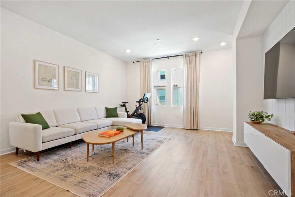 Nestled in the highly desirable Orchid Community built by KB Homes in 2022, this modern 4-bedroom, 3.5 bathroom townhome style condo offers the perfect blend of style, comfort, and functionality. With thoughtful designed living spaces spread across three levels, this home captures a bright, airy vibe and makes everyday living effortless. This three-level home boasts an open-concept great room with abundant natural light, vinyl plank flooring, and a seamless flow between the living, dining, and kitchen areas. The kitchen features quartz countertops, sleek shaker-style cabinetry, a butler's pantry, and Whirlpool stainless steel appliances, including a gas cooktop, wall oven, microwave, and dishwasher. The spacious primary suite offers dual sinks, a walk-in shower, cultured marble countertops, and a large built in wall closet. Three additional bedrooms provide flexibility for guests, a home office, or a growing household, including a convenient entry-level bedroom with its own en suite. All bathrooms are thoughtfully designed with stylish finishes and Moen fixtures. Additional highlights include a SunPower 10-panel solar system (owned), and Ecobee Smart Thermostat, EV charger prewire, surround sound prewire, recessed lighting throughout the home, and a two-car attached garage with direct access. Offering 1670 sq ft of living space, this home truly combines modern comfort, smart features, and a convenient location, making it the perfect place to call home.