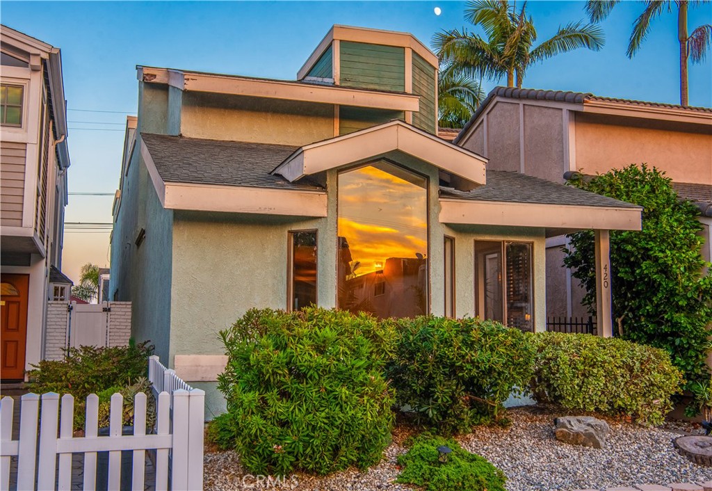 Fantastic LOCATION + fantastic LAYOUT + fantastic POTENTIAL = FANTASTIC OPPORTUNITY! Welcome to this 3 BED, 2.5 BATH + BONUS ROOM home in one of downtown Huntington Beach’s most desirable interior blocks. Google Maps say...just a 7-minute walk to the beach and a 20-minute walk to Main St...but tucked just far enough away from the Main Street buzz. With approximately 2,413 SQFT of living space, this property offers the perfect canvas to create your dream coastal home. The floor plan is thoughtfully designed with DEDICATED SPACES FOR LIVING, DINING, KITCHEN, AND FAMILY. Vaulted ceilings and LARGE WINDOWS in the front living room bring in tons of NATURAL LIGHT, setting the tone for a bright and welcoming space. AN UPSTAIRS BONUS ROOM at the front of the home provides flexible use as a den, office, or guest area… add a window to this room to increase light and value. Upstairs, the PRIMARY SUITE IS ENORMOUS and includes a unique TWO-STEP PLATFORM ideal for a sitting area or reading nook. The primary bathroom features DUAL VANITIES and excellent light. Two additional bedrooms share another LARGE BATHROOM, also with DUAL VANITIES. This makes busy mornings easy-breezy. Convenient UPSTAIRS LAUNDRY and a DOWNSTAIRS POWDER ROOM add practical comfort. Recent updates include a NEWER FLAT ROOF (May 2024), 2012ish for the remainder of the roof, termite work completed (Jan 2024), and well-maintained structural systems, giving you a solid base to build upon. The BACKYARD offers space for outdoor lounging, entertaining or gardening... PLUS the UNIQUE ZERO LOT LINE offers more useable outdoor space AND offers twice the downstairs windows and sunlight of other interior locations. Desirable SMITH ELEMENTARY, DWYER MIDDLE, and HUNTINGTON BEACH HIGH SCHOOLS are all just minutes away AND local favorite, Fiesta Grill and 17th Street Park are an EZ two block walk. Whether you're an investor, a designer, or want to create the home of your dreams, this BLANK CANVAS is your opportunity to own something truly special in the heart of Huntington Beach.