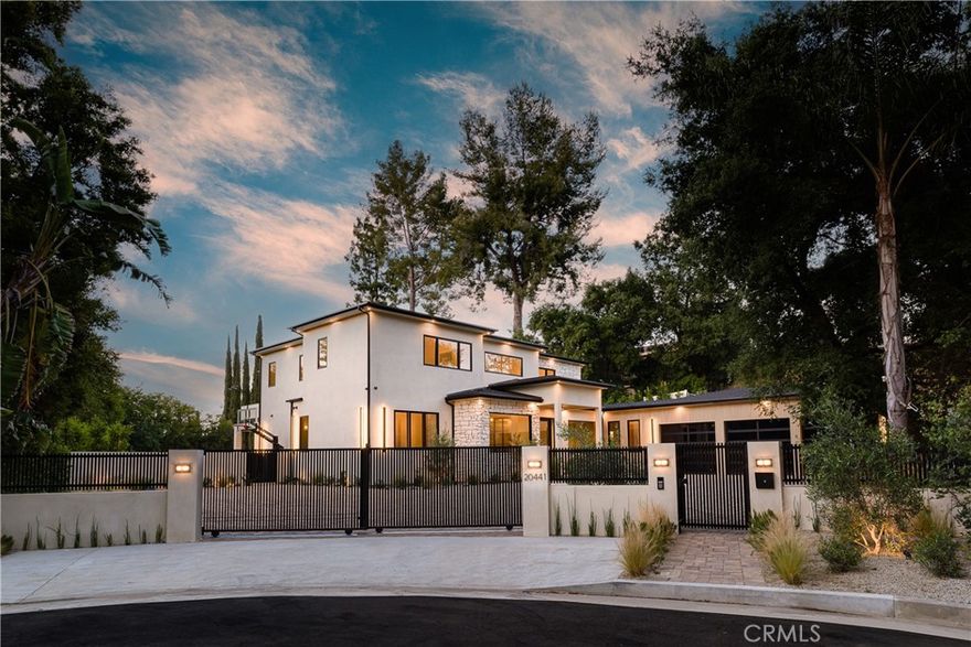 AVAILABLE FOR LEASE! Introducing a stunning contemporary estate that redefined excellence, offering unparalleled design and luxurious living. Located in a peaceful cul-de-sac South of the boulevard, this custom-built home sits on a spacious 19,603 sqft lot, offering a serene environment for the perfect escape to call home! Spanning nearly 6,500 sqft, this gated architectural marvel boasts 5 bedrooms, 6.5 bathrooms, an office, state-of-the-art home theater, and a plethora of outdoor amenities. With multiple dining and entertaining areas, and beautifully landscaped grounds, every corner of this home exudes elegance and sophistication. Step outside to discover an oasis featuring an oversized sparking pool, spa, open cabana with a fireplace, a recreation room with a full bathroom, a sports court and an outdoor kitchen with a custom-built BBQ. The culinary haven of the house, the Kitchen, showcases custom cabinetry, double sinks, double dishwashers, Thermador appliances, paneled refrigeration, temperature controlled wine fridge, 60” range with double ovens, an incredible walk in pantry and an island with a built-in breakfast table. The luxurious primary suite boasts a fireplace, private balcony, and a spa-like bathroom with stone accents and two toilets and a soaking tub. With a 3-car garage and room for 12 cars in the driveway, this home offers convenience with every luxury imaginable and is ready to fulfill your heart's​​‌​​​​‌​​‌‌​​‌​​​‌‌​​​‌​​‌‌​​​‌​‌​​​‌‌​ desires!