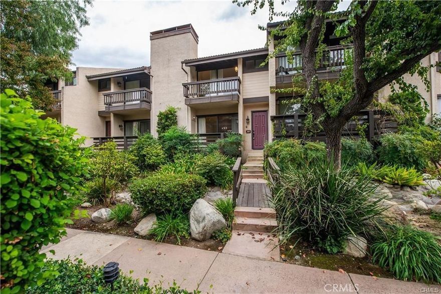 Welcome to this beautifully updated Warner Village townhouse—an inviting home that combines comfort, style, and resort-like amenities in the heart of Woodland Hills. Nestled in serene, park-like grounds, this tri-level townhouse offers 3 bedrooms and 3 bathrooms across 1,624 sq ft of thoughtfully designed living space. As you step through the front door, you’ll be greeted by an open, bright foyer that flows into a cozy living room complete with a fireplace and large patio—perfect for indoor-outdoor living and entertaining. New flooring runs throughout much of the home, enhancing the warm, welcoming feel. The kitchen features granite countertops and a breakfast nook, with space for casual dining. The formal dining area sits nearby with a convenient half bath close by for guests. Upstairs, you’ll find two large bedrooms and the master suite with soaring ceilings, expansive closets, and its own private patio. These spaces feel bright, comfortable, and tranquil. On the lower level is another versatile bedroom that works perfectly as a guest room or a home office. Outside your front door, the community offers resort-style amenities, including a pool, tennis courts, and well-maintained grounds. The complex is quiet and well cared for. You’re very close to The Village at Warner Center, groceries, shopping, and everything Woodland Hills has to offer. Easy access to freeways and nearby amenities makes daily living a pleasure. HOA dues also include water, internet and cable.