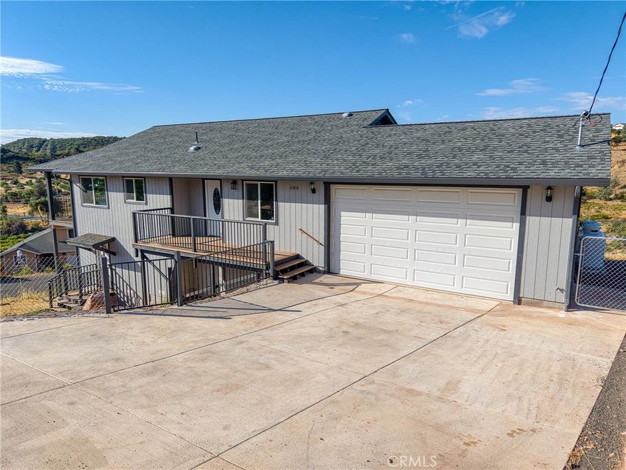 Brand New Construction! This contemporary residence features a variety of impressive amenities and refined design elements. 

The home's key features include a spacious, fenced yard, a level driveway, and an inviting front deck. The interior boasts an open floor plan with vinyl plank flooring, modern can lighting, sprinklers, and classic finishes. The great room has vaulted ceilings and is illuminated by numerous windows and seamlessly connects to the kitchen, which is equipped with a center island, stainless steel appliances, and quartz countertops. The adjacent dining room includes a slider door leading to a covered deck, ideal for outdoor living. The private primary bedroom offers an en-suite bath with double sink vanity and a tub/shower combo, with granite counter tops and is strategically separated from the other bedrooms. Bedroom 2 provides views of Mt. Konocti and is conveniently situated near the hall bath, also featuring a tub/shower combination. Additional amenities include an interior laundry room with direct access to an attached two-car garage.  A third room would make a great  home office or den. Efficiency features include solar and on demand water heater Mini split AC units and Propane heat. The seller is also offering an exciting expansion opportunity: the lower, undeveloped area of the home has received approval for a 670+ square foot bonus ADU studio unit, it can be completed to include a full kitchen and bath. For details on this current additional space and cost to expand this area, please contact the listing agent. This home is located in the Kelseyville Riviera, a desirable community situated just above Clearlake, offering convenient access to schools and shopping. Residents can enjoy year-round water sports and fishing from Californias largest natural lake.