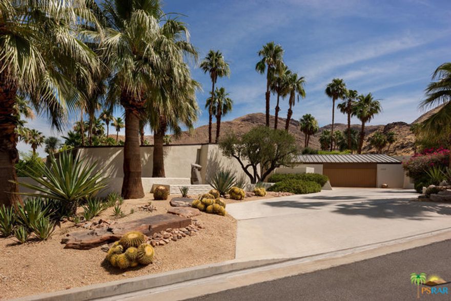 The Russo House, 1974, by Walling and McCallum. Architecturally significant, one-off, tennis court estate located high up in the Andreas Hills area of Palm Springs on a breathtaking private lot. Strong architectural lines draw you through this home with soaring ceilings throughout. Expansive walls of glass blur the distinction between indoor and outdoor living, uniquely designed to capture mountain and garden vistas from all rooms. Exceptional master wing with double walk-in closets and double baths. Two bedroom, two bath guest wing, office/den, large family room, multiple patios and outdoor loggias, pool and spa, sauna and tennis court. Fee-simple land.