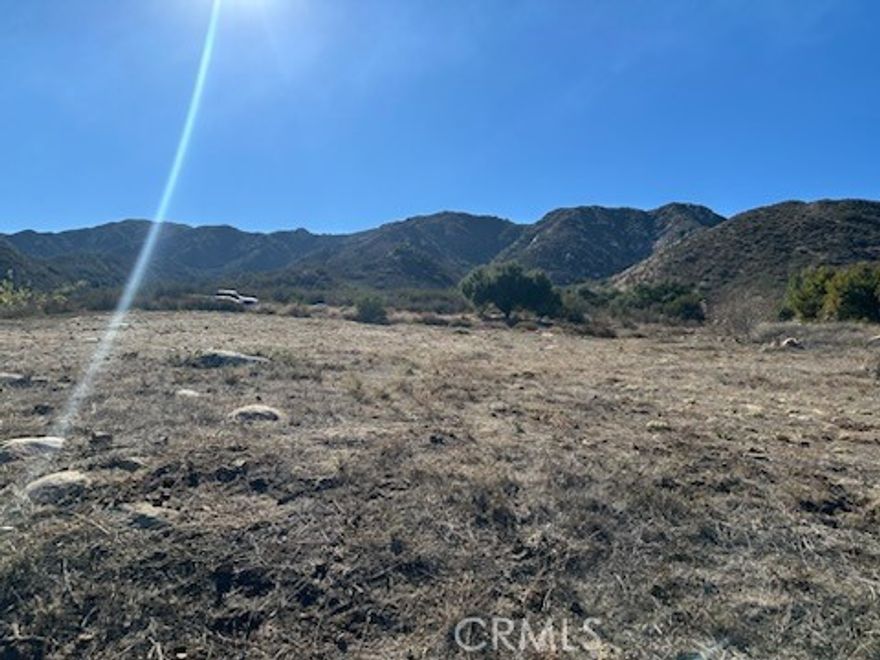 49,658 square feet (1.14 Acres) up in the hills overlooking Lake Elsinore. Land features a slight upslope with homes next door and across the street. Perfect for a custom home or manufactured home. Property is not far from the Lake. All offers will be considered.