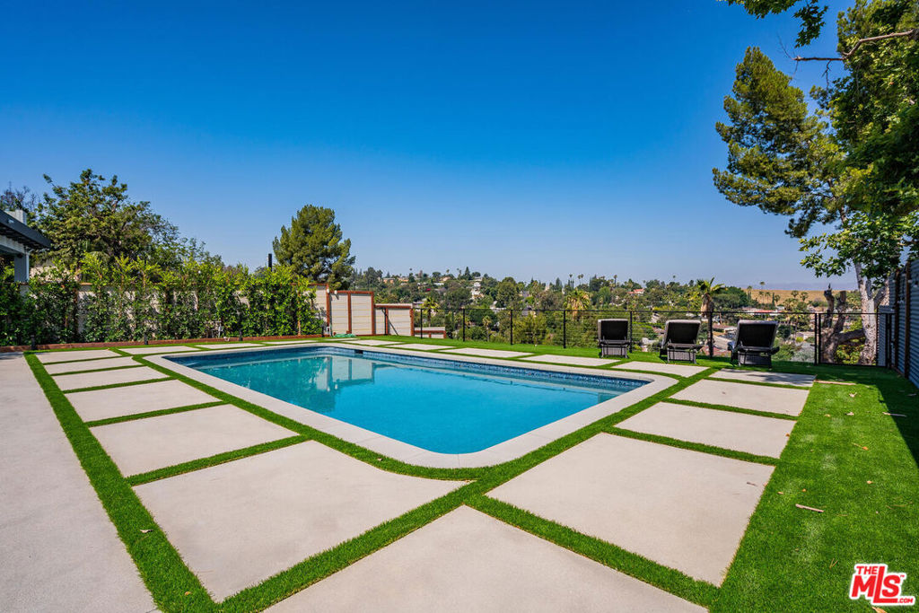 FULLY-FURNISHED, FULLY-EQUIPPED HOME. AVAILABLE FOR SHORT AND LONG STAYS. Ideal location in peaceful Woodland Hills neighborhood minutes away from plenty of restaurants, shops, & entertainment on Ventura Blvd. Resort-like backyard w/ in-ground pool & tanning beds. Covered patio w/ outdoor furniture, BBQ, & outdoor dining. Master bedroom w/ smart TV & walk-in closet. Second bedroom w/ stunning glass doors for backyard views. Wall-to-wall hardwood flooring & large windows welcoming natural light into the home. Fully-stocked kitchen w/ chef grade appliances, bar seating & dining. EV charger outlet outside. Guest house on the premise. Listed price is based on a one year rental. Please inquire for short term rates.