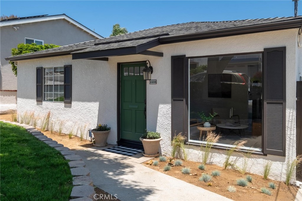 Rare opportunity for a large lot in the Golden Hills. Loads of potential here with so many different ways to maximize your investment... add-on and renovate, build an ADU, or just build a brand new house from the ground up? Look no further than 1108 Stanford Ave. as your blank canvas to draw your future. The current home is beautifully updated, nestled in the desirable Golden Hills neighborhood of Redondo Beach, and lies within the Jefferson Elementary School District, offering easy access to Hermosa Beach and the vibrant Hermosa Pier. This home has been meticulously renovated inside and out, from top to bottom. The interior and exterior boast fresh paint, and the hardwood floors in the living room and kitchen have been recently refinished. The modern kitchen features re-glazed countertops, lacquered cabinets with new hardware, a gas range, hood, dishwasher, and pre-installed hookups for a reverse osmosis filtration system. Thoughtfully upgraded by a skilled contractor, this home showcases professional enhancements to its systems. Notable improvements include three separate mini-split heating and air conditioning units, a tankless water heater with a recirculating pump, a re-glazed bathtub, and a stacked washer/dryer conveniently located inside the main house—eliminating the need to visit the detached garage for laundry. Recessed lighting illuminates the kitchen and living room, and the electrical wiring has been updated in the living room and bedrooms. The bedrooms feature spacious wall-to-wall closets, ready for custom built-ins or perfectly functional as is. The exterior is equally impressive, with a freshly landscaped front yard featuring a paver retaining wall, a decomposed granite walkway, new plants, full irrigation, and a lockable driveway gate for added privacy and a safe, enclosed space for children or pets. The backyard, equipped with irrigation and fresh seeding, includes a beautifully rebuilt deck off the kitchen—perfect for gatherings and showcasing partial mountain views on clear days. The detached garage includes an unpermitted full bathroom and kitchenette, along with a complete set of ready-to-submit plans for an accessory dwelling unit (ADU), including structural and energy calculations, a survey by renowned Denn Engineers, and 3D renderings. Additionally, all water lines for the house have been re-piped, including underground lines to the garage, facilitating future ADU construction or home expansion.