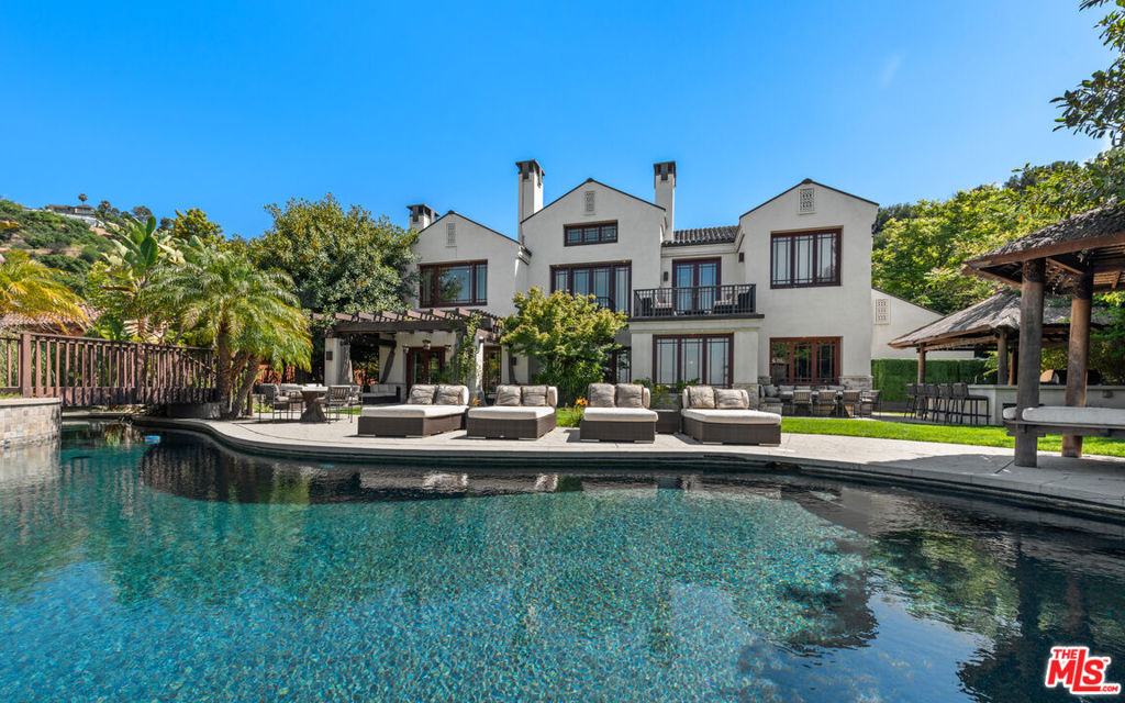 Welcome to this fully furnished, sophisticated residence located in one of Beverly Hills's most exclusive and prestigious, guard-gated communities of Mulholland Estates. Upon entering this serene retreat, guests are greeted by tall ceilings and custom decor design influence, setting the tone for the exquisite features within. This impressive and spacious luxury living space features 4 bedrooms and 6 bathrooms, a private office and balcony perfect for enjoying tranquil moments, complete with sunset views of the canyons, a pool and BBQ area. A 24-hour guard-gated entrance ensures both privacy and security. The community amenities include tennis courts, racquetball courts, basketball courts, dance studio and children's playground. Experience the epitome of luxury living in this gated community where privacy and security are paramount.