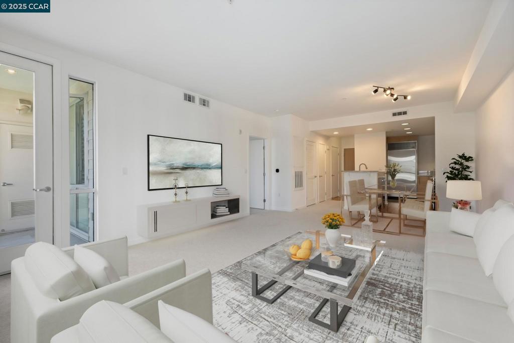 Incredible opportunity to own in Walnut Creek - best price in the Mercer building and one of the best locations with views, private patio, 2 parking spots and in-unit laundry! This modern 1-bedroom, 1.5-bathroom condo spans 886 square feet, offering an open-concept living area with great natural light and offers access to the private balcony (with views of the hills). The kitchen offers a sleek design with stainless steel dishwasher, range, microwave and refrigerator. Enjoy the convenience of a washer and dryer in-unit and a half-bath for guests. The primary suite includes a spacious and updated bathroom and ample closet space. Enjoy the amenities such as a communal pool, hot tub, gym, and spa. Rarely available, this unit comes with two side-by-side parking spaces. All this and just a half mile to BART in the heart of downtown Walnut Creek! (Living room and dining room were virtually staged in these photos.)