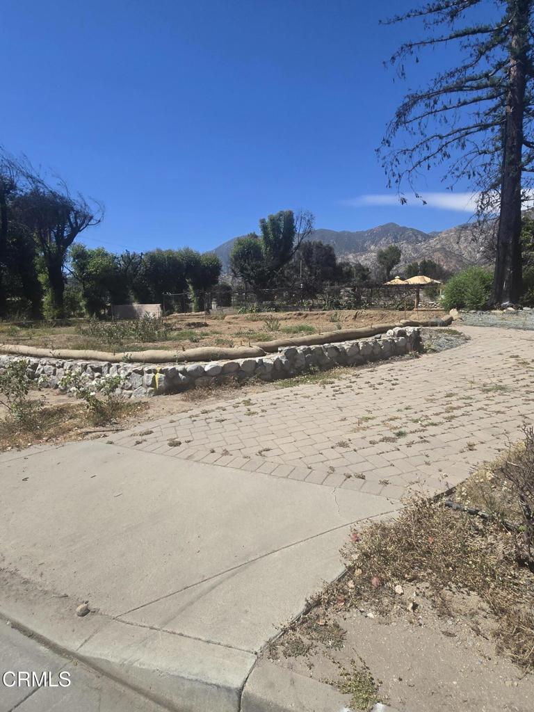 Situated on a spacious 6,867 SF corner lot in one of Altadena's most sought-after neighborhoods, this property offers a rare chance to bring your dream home or investment vision to life. Nestled in a quiet pocket of Altadena with close proximity to parks, shops, and major freeways, it combines natural beauty with everyday convenience. Whether you're planning to build a custom home or explore development potential, the lot's size and location open the door to a range of possibilities. Zoned LCR175, the site is ready for development--Phase 1 and Phase 2 debris removal have already been completed as well as the property survey. Water, gas, and electric services were previously connected and may be available for reconnection (buyer to verify). An existing paved driveway, along with a side driveway, remains on the property, offering excellent accessibility and flexibility for future construction..