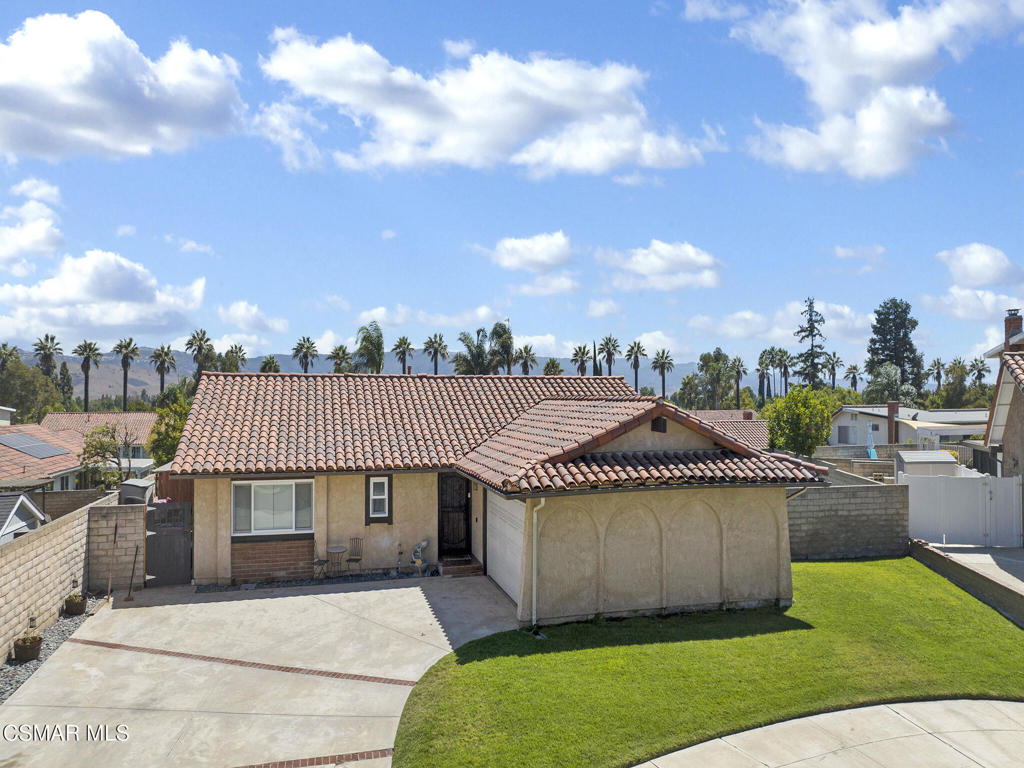 Welcome to 3278 Garnet Place, a beautifully upgraded single-story home nestled in a quiet cul-de-sac in desirable Central Simi Valley. Offering 3 bedrooms, 2 bathrooms, and 1,446 sq ft of living space on a spacious 8,276 sq ft lot, this home blends comfort, style, and functionality. Inside, you'll find rich wood laminate flooring throughout and striking vaulted, scraped open beam ceilings that create an open and airy feel. The spacious family room is perfect for relaxing or entertaining, while upgraded dual-pane windows and a sliding glass door fill the space with natural light. An upgraded HVAC system ensures year-round comfort and energy efficiency. The heart of the home is the inviting bar-style eat-in kitchen and adjoining dining area with fireplace--ideal for casual meals and gatherings. Both bathrooms have been tastefully updated with modern finishes. Step outside and experience California living at its best. The backyard boasts a large, covered patio, a separate seating area with a charming pergola, and a cozy firepit, making it perfect for entertaining. The upgraded sprinkler systems in both the front and back yards keep the landscaping lush and green year-round. And yes--there's even a chicken coop with chickens included! This property combines a prime Central Simi Valley location with thoughtful upgrades and a welcoming layout. Don't miss your chance to make this one-of-a-kind home yours!