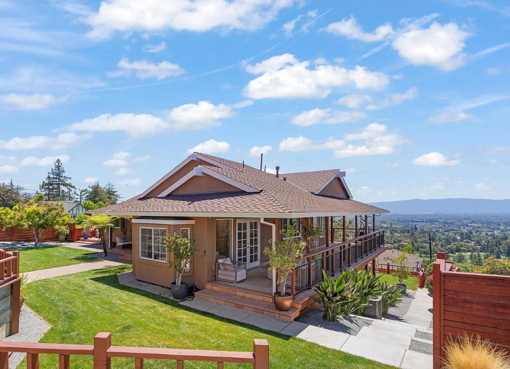 Exquisitely remodeled home with sweeping city light & mountain views above San Jose Golf Course, offering premier golfing and dining nearby. Open floor plan with vaulted ceilings, hardwood floors & expansive glass walls. Gourmet kitchen with Thermador appliances, quartz counters & waterfall island. Primary suite with vaulted ceilings, window seat & French doors to covered porch. Downstairs: family room, 2 bedrooms, luxe bath & patio access. Central AC, 2-car garage, lush landscaping, multiple outdoor entertaining areas & 2 covered porches. Close to Alum Rock Parks 720 acres of hiking, horseback riding, bicycling & picnic areas.