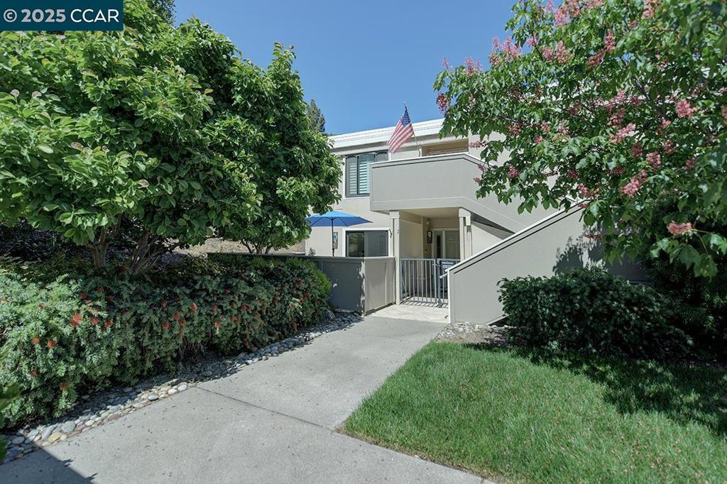 Stunning Level-In (no steps) Full Manor Renovation! Experience luxury living in beautifully remodeled Carmel model end-unit by Gregory R. Brown Custom Builders. Located in a serene setting w/front & rear patios and near Rossmoor’s main community centers/amenities. Front entry opens to a spacious tiled patio w/lovely maple tree and has access from dbl pane slider to front bedroom/den. Inside, enjoy vinyl wood floors, smooth ceilings, recessed lighting, crown moulding and double pane windows w/custom window treatments. Elegant bathroom features custom tiled stall shower, stacked Bosch washer/ventless dryer (w/plumbed drainage), and linen closet. Both bedrooms include full-wall designer closet "Elfa-organizers" and beautiful crystal light fixtures w/hidden ceiling fans. Chef’s kitchen boasts granite countertops, SS appliances includes induction cooktop, side-by-side stainless refrigerator, custom cabinetry, recycle/trash drawer, built in microwave, and dishwasher. Steps to covered carport #4 w/storage closet, this gem is ready to be yours! Home is located in the prestigious 55+ Rossmoor gated community, this home provides access to an array of luxurious amenities and a vibrant social scene, fitness cntr., trails, 5 community centers, game/hobby rms, 200+ clubs & organizations.