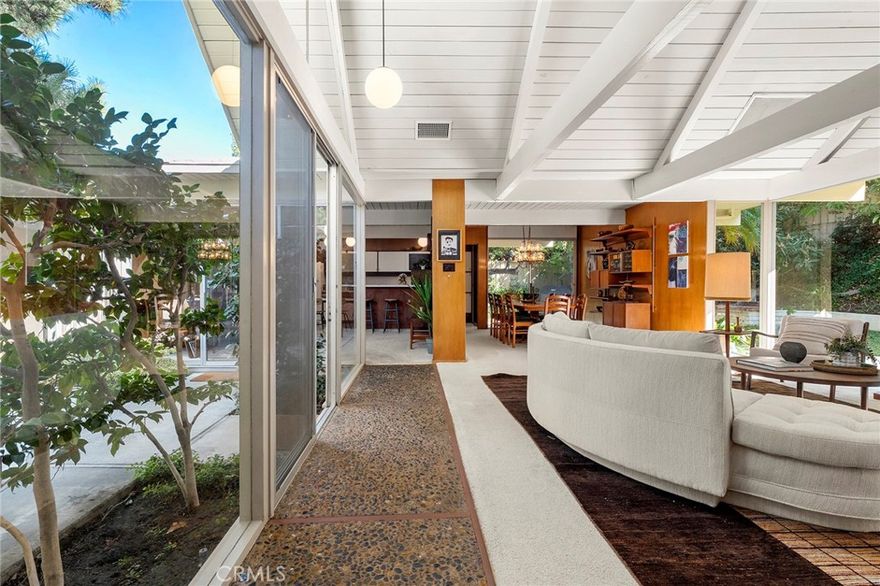 THE TOY RESIDENCE | A Jones & Emmons Masterwork
Fairhills, Orange | 1964 | The Largest Model in the Neighborhood
In the last five years, exactly three authentically original Eichlers have surfaced in Orange County. This is one of them. Houses like this don't circulate—they hibernate with families who understand what they have. The Toy family did. For 36 years, they lived here. For nearly a century each, they thrived here. You can feel that devotion in every Philippine mahogany panel.
THE BONES
The largest Jones & Emmons model in Fairhills—built in Orange's only Eichler neighborhood with underground powerlines. Architecturally intact in ways that make preservationists weep.
The Greatest Hits:
Aggregate walkway • Philippine mahogany walls • Signature atrium • Walls of glass • High tongue-and-groove ceilings + post-and-beam • Skylights • Original kitchen & bathroom vanities • Split-wing floor plan with pool access
THE PRAGMATICS
This house is solid. Recent systems: Foam roof (coated) • Hot & cold water repipe • Sewer line sleeved • Two HVAC units (brand new + 2-year-old) • Upgraded electrical • Pool ready for your vision
You're not inheriting deferred maintenance. Big-ticket items are handled. Your budget goes toward—the fun stuff that makes it yours.
THE FAIRHILLS DIFFERENCE
Mature trees. Quiet streets. The kind of neighborhood where people wave at dusk.
THE LIFESTYLE
Living in a glass-box home alters your relationship with time, light, and seasons. You'll watch storms from your atrium. You'll understand why post-and-beam isn't just structure—it's rhythm.
This is for people who understand that original Philippine mahogany isn't just wood—it's a conversation with 1964. Who know authenticity isn't a trend; it's a discipline.
Live where you Love. Love where you Live.
The Toy Residence isn't asking you to fix it. It's asking you to continue it. You deserve a house that's already solid. Already sacred. Already yours—you just don't have the keys yet.