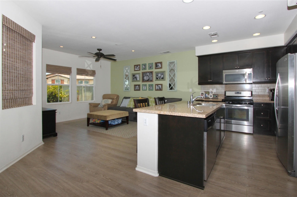 ALMOST BRAND NEW! Gorgeous 2012 townhome LOADED WITH UPGRADES! This is a MUST SEE Spacious 1649 sqft 3 bedroom,2.5 bath home. Has an Attached 2 Car Garage, Gourmet Kitchen with Granite Countertops, Custom Paint, Beautiful Laminate Wood Flooring, Full Size Laundry Room, Light Bright and Airy with Lots of Windows and Artificial Grass Installed on the Patio! Private Lot with a Great Park Like BBQ Area and Playground walking distance to the home! SHOWS LIKE A MODEL! Just off Highway 78,Easy Access to Freeway Neighborhoods: Candera Equipment: Dryer,Garage Door Opener, Range/Oven, Washer Other Fees: 0 Sewer: Sewer Connected Topography: LL
