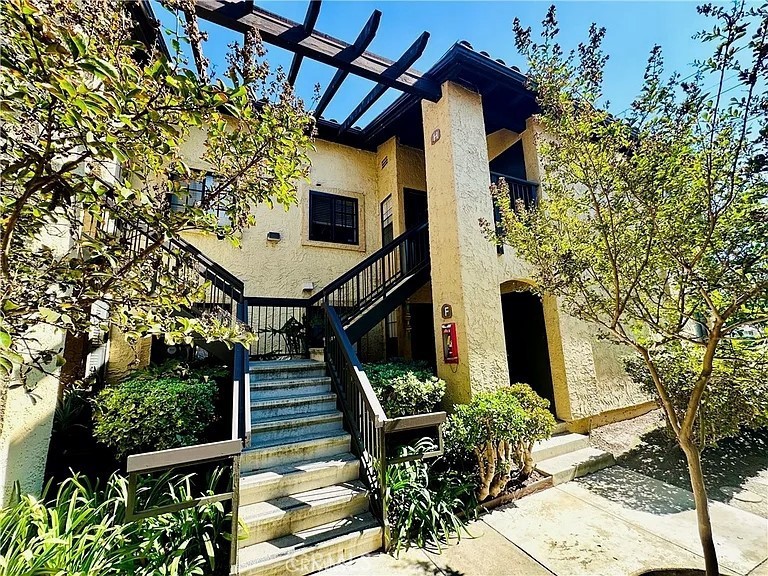 Welcome to Bella Tierra, a charming gated community nestled in one of Laguna Hills' most convenient locations! This 2-bedroom, 2-bathroom condo is thoughtfully designed for both comfort and style, perfect for first-time buyers, downsizers, or anyone seeking low-maintenance living with upscale touches. Enjoy an updated kitchen with sleek granite countertops, stainless steel appliances, and ample cabinet space. The spacious living room features a cozy fireplace and opens up to a large private back patio ideal for relaxing or entertaining. With dual master suites, each with its own private bath and walk-in closet, this layout offers flexibility and privacy. Additional perks include in-unit laundry, extra storage closets, and an assigned carport. Residents love the community pool, spa, and tranquil setting, all while being just minutes from local parks, top-rated schools, shopping, dining, and easy freeway access.