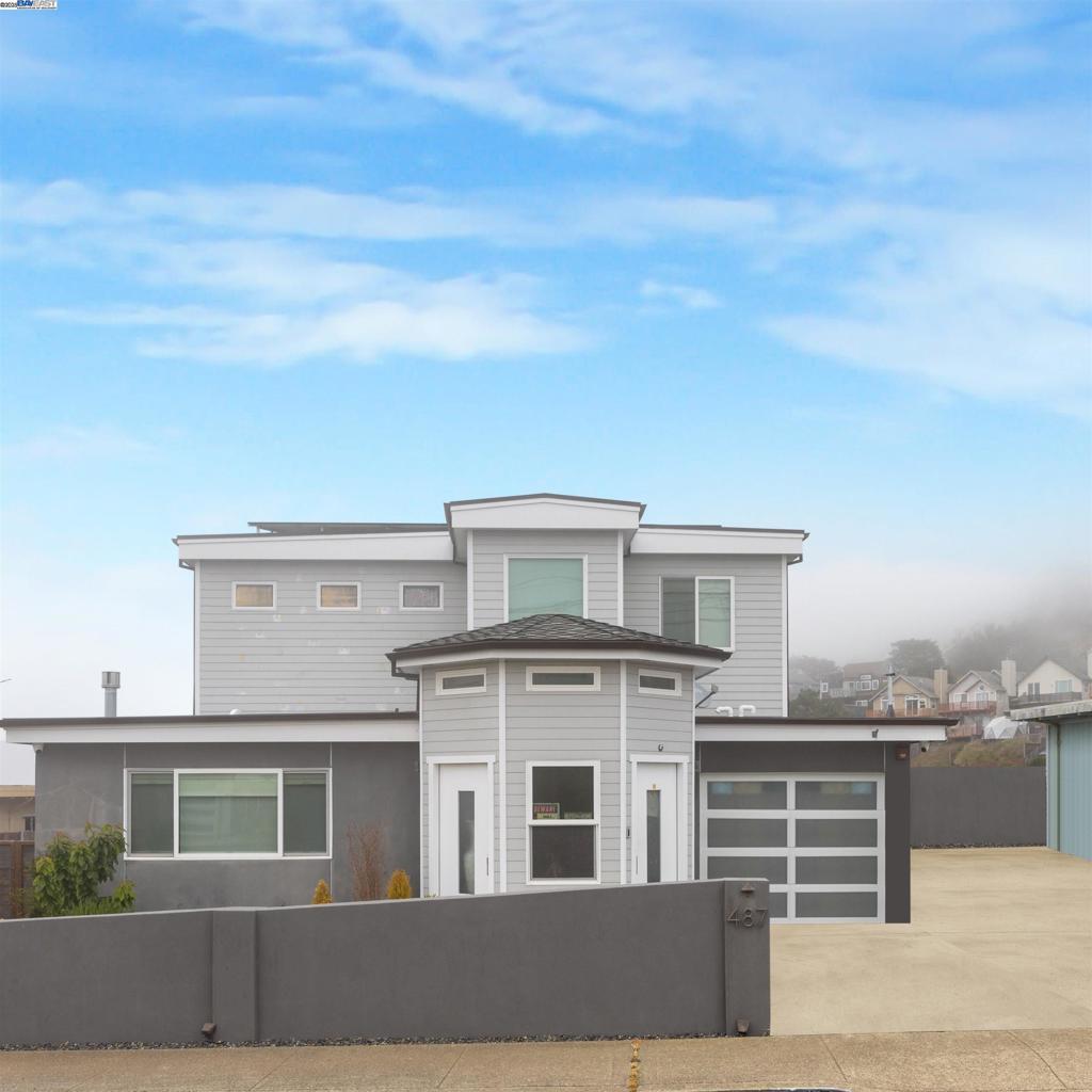 This 3-bed, 4-bath home with 2,414 sq ft was essentially built in 2016—only one wall was kept for permits. Nearly everything is brand new: foundation, framing, electrical, plumbing, finishes, solar and more. Features include a tiled foyer, recessed lighting, crown molding, detailed baseboards, dual-pane windows, and engineered hardwood floors. Each bedroom is a private suite with its own full bathroom—ideal for multi-gen living, guests, or rental potential. Enjoy Pacific Ocean views, a built-in projector perfect for movie nights, and a high-end security system. The spacious highend kitchen flows into open living and dining areas, great for entertaining. Ample storage, indoor laundry, and thoughtful design touches throughout. Located just 2 minutes to Edgemar Park and close to beaches, trails, shopping, and top-rated schools. With premium craftsmanship, a flexible layout, and a coastal lifestyle, this home is a rare Pacifica gem.