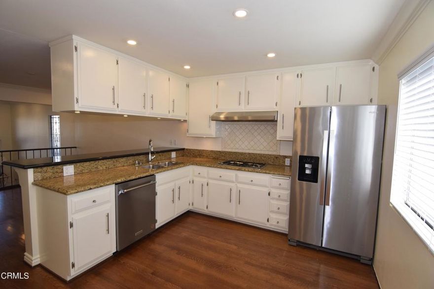 Cats OK (no more than two).  Dogs not allowed.  Sorry about that.  This inviting gated community offers resort style living with ample parking, four different pool areas, and plenty of lush landscaping to make your daily walks enjoyable.  Inside, most everything has been renovated from its original character, with hardwood floors throughout and carpet in the three bedrooms.  The white colors are welcoming and modern, and the home is very clean.  Even the interior heating and air conditioning vents were professionally cleaned!  The layout is comfortable and spacious.  Cabinetry abounds in closets and rooms, and you will appreciate these extra spaces for storage.  A two car garage is adjoined to the home, and a laundry room sits just off the kitchen area.  Enjoy the balcony from the primary bedroom, or sit outside in your private and gated front patio to catch that ocean breeze.  Basic cable and internet service is included in the rent, provided by Spectrum.  So close to many things, and you can chose to drive or walk somewhere.  There is a lot to do.  Are you ready to call this your next home?