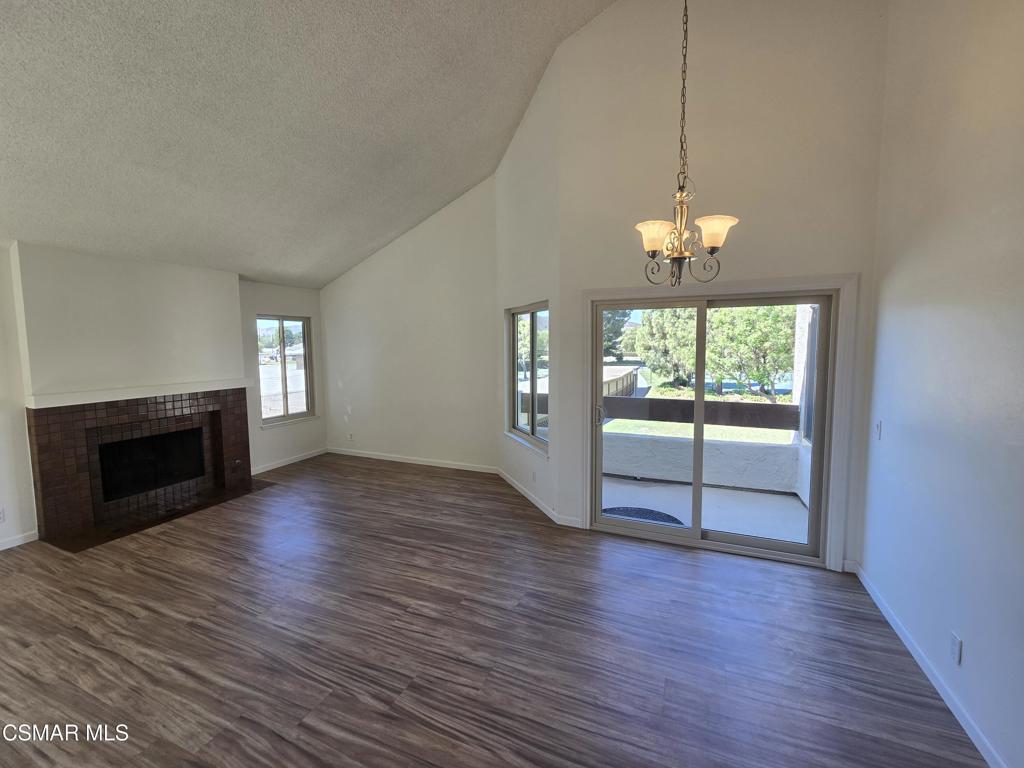 Location, Location, Location! This gorgeous condo is perfectly situated next to and overlooks the large park-like green space and Simi Hills. Imagine having a nice breakfast on your balcony. A lovely view of the lighted tennis courts, pool, spa, and clubhouse are nearby. The unit has been tastefully upgraded with new windows throughout, newer vinyl flooring, re-glazed tub/showers, newer kitchen counter. The vaulted ceiling in the living room is quite spacious and has a cozy fireplace. Water, trash, and earthquake insurance included.