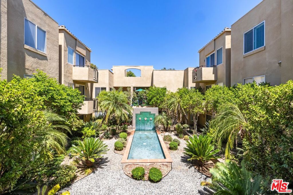 Set in the heart of Studio City, this beautifully updated two-bedroom, two-bath unit combines modern sophistication with that all important location. The open layout welcomes you with natural light and a spacious living area that flows seamlessly to a balcony and private rooftop deck. The sleek kitchen boasts quartz breakfast bar and stainless steel appliances, while the primary suite features a generous walk-in closet and a spa-like bath with dual vanities and a soaking tub. With in-unit laundry, two tandem parking spaces with EV charger, and a pool and rec room, this home offers both ease and luxury, all just moments from Ventura Boulevard's dining, shopping, and vibrant energy.
