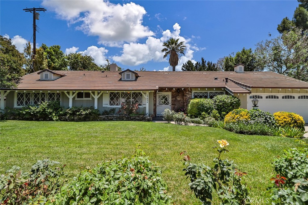 Elegance, comfort, and timeless charm come together in this beautifully maintained single-story home, nestled on an expansive 10,647 sq ft lot. Offering 3 spacious bedrooms, 3 bathrooms, and a dedicated office, this 2,551 sq ft residence blends functionality with refined style. Accentuated by a lush lawn and a classic meandering walkway, the home welcomes you with warmth and character. Inside, natural light fills every corner, enhancing the inviting ambiance. The spacious living room features vaulted beamed ceilings, a fireplace, and French doors that open to the rear patio, effortlessly connecting indoor and outdoor living.The cozy den is ideal for entertaining, complete with its own fireplace, built-in bar, and guest bathroom, making it a perfect space for gatherings, game nights, or relaxed evenings in. The additional office provides a peaceful space for remote work, study, or creative pursuits. Step outside to your private backyard oasis complete with a sparkling pool, mature landscaping, vegetable garden boxes, and many fruit-bearing trees including mango, peach, plum and more, all surrounded by greenery for enhanced privacy. Ideally located near CSUN, Northridge Fashion Center, and top-rated schools including the coveted Granada Hills Charter High School and Northridge Academy High School (NAHS). Enjoy easy access to outdoor recreation at Northridge Recreation Center, nearby Dearborn Park, and the vibrant CSUN campus with its Botanic Garden and planetarium. A rare opportunity to own a home that offers space, serenity, and convenience in one of the Valley’s most desirable neighborhoods. Several of the images have been virtually staged.