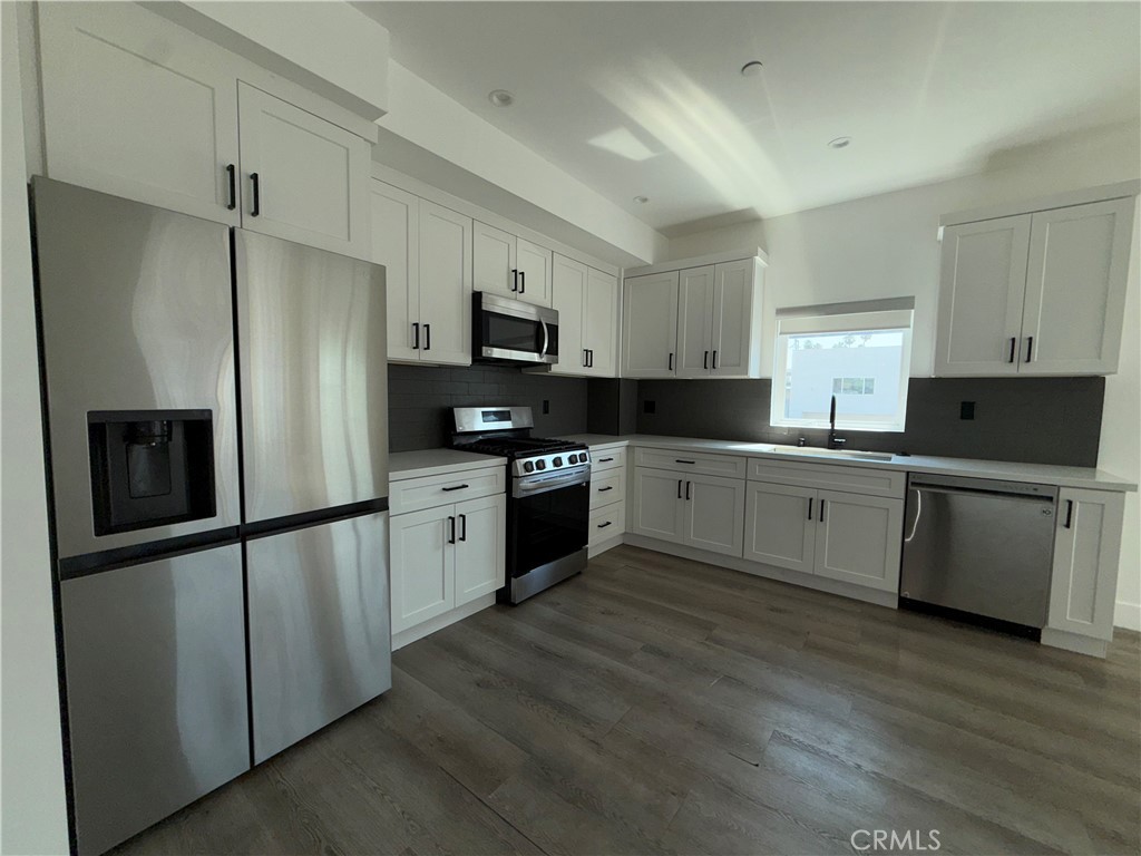Modern and stylish 2-bed, 2.5-bath townhome built in 2023, offering contemporary finishes and an open floor plan. The spacious living area flows seamlessly into the gourmet kitchen featuring sleek cabinetry, stainless steel appliances, and quartz countertops. Upstairs, both bedrooms include en-suite baths for privacy and comfort. Additional features include in-unit laundry, central HVAC, and an attached 2-car garage. Located near shopping, dining, and easy freeway access. Tenant to verify all information, including square footage and school boundaries.