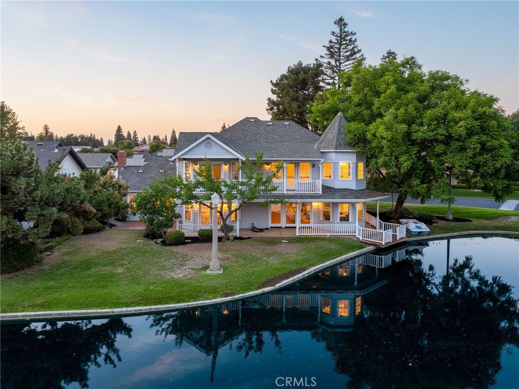Why settle for someone else's idea of dream home'' when you can create your own? This lakefront property in the exclusive, guard-gated community of The Lakes is more than just a house, it's a blank canvas with a front-row seat to water views from nearly every south-facing window. Think soaring ceilings in the living room, a grand staircase worthy of its own entrance scene, and two fireplaces for double the cozy vibes. Thewrap-around front to back porch begs for lazy afternoons, while the master suite offers vaulted ceilings and a private deck overlooking the lake basically your own VIP lounge for sunrise or sunset.
Sure, it needs a little updating, but here's the best part: it's move-in ready. That means you can enjoy life on the lake right now all while planning the updates that will turn this into your true masterpiece. Modern chef's kitchen? Spa-style bathrooms? Entertainer's paradise?The home already offers it all from the large open kitchen to the two spacious living rooms, a loft, and an isolated downstairs bed and bath, perfect for a private office or a stunning guest retreat.
You're not just buying a house, you're buying the opportunity to create something spectacular, designed entirely around your style. With its unbeatable location, timeless layout, and one-of-a-kind lakefront setting, this home isn't just potential it's the possibility of creating your masterpiece.