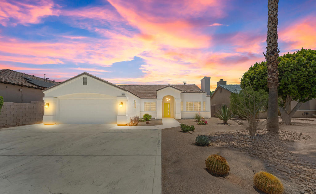 Stunning Designer Remodel in the Upper Outpost of Cathedral City. Welcome to this fully reimagined showstopper in the highly sought-after Upper Outpost neighborhood of Cathedral City. No detail was spared in this top-to-bottom transformation--every inch of this property has been thoughtfully renovated to today's highest living standards, with striking designer touches throughout that truly make it a flagship home for the area. Step inside to an open-concept layout featuring a dramatic great room centered around a custom black tile fireplace with elegant gold accents. The seamless flow of the high-end stained concrete flooring adds warmth and style across the entire space. The chef's kitchen is a true centerpiece--boasting all-new custom cabinetry, premium stainless steel appliances, and an oversized island with seating and expansive workspace perfect for entertaining. A cozy breakfast nook and separate formal dining area complete the space. This home offers 4 spacious bedrooms and 2 luxuriously appointed bathrooms. The primary suite is a private retreat with a resort-style bath featuring a large walk-in tile and marble shower, freestanding soaking tub, and floating dual-sink vanity. The guest bath also showcases a tiled walk-in shower and dual vanity with stylish designer finishes. With over 2,000 sq. ft. of modern living space and a fully finished 2-car garage with new epoxy floors, this home checks all the boxes. The oversized driveway provides ample room for RV or boat parking. The expansive backyard includes a covered patio and a large lawn--offering plenty of space for a pool, gazebo, or built-in BBQ. The possibilities are endless. This is the one you've been waiting for--schedule your private tour today before it's gone!