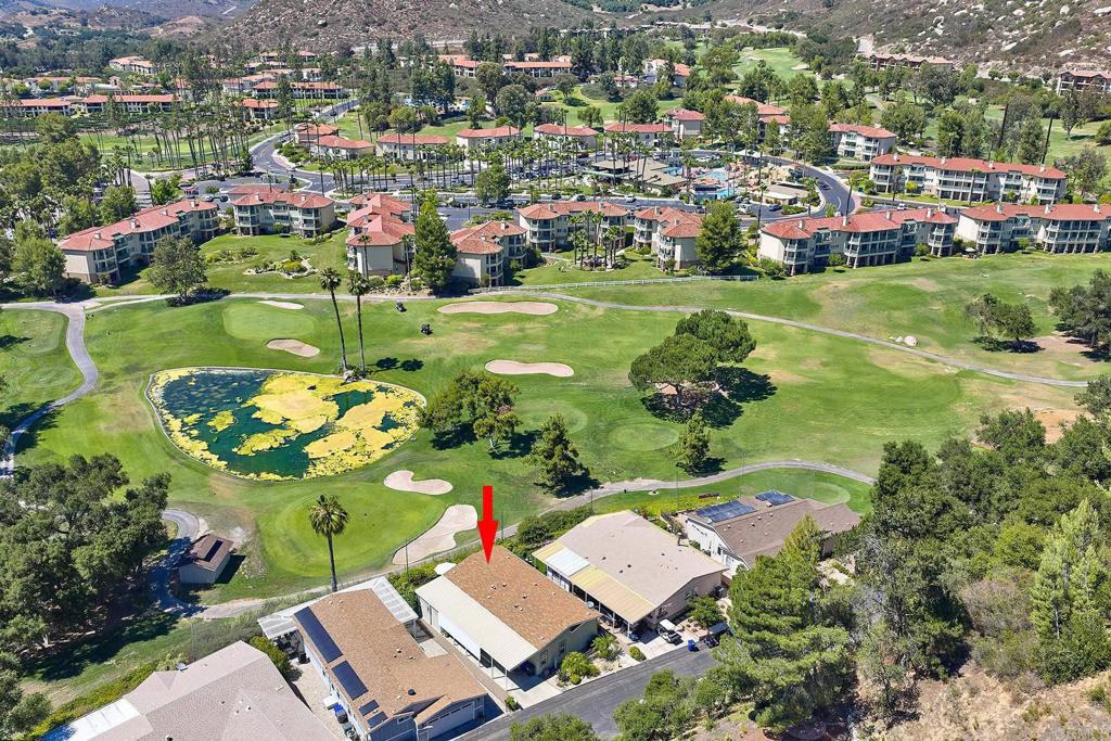 Built in 2011, this beautifully upgraded home sits one of the few available golf course lots in Escondido’s sought-after 55+ senior community, Champagne Village. This property showcases stunning panoramic vistas of the resort, lush fairways, and scenic hills, offering a truly elevated lifestyle. Enjoy a bright, open layout with modern upgrades, including laminate flooring, updated fixtures, a NEW water heater (July 2025), refrigerator (Jan 2025), washer & dryer (June 2025), and nearly new dishwasher. The home features an indoor laundry room, 433-A permanent foundation, and a spacious primary suite with a walk-in closet. The low-maintenance yard includes faux turf, a stone seating area ready for a firepit, and a large storage shed. Community amenities: Pickleball & tennis courts, pool & spa, clubhouse, billiards, RV parking, BBQ area, car wash station, gym, and more. Residents enjoy 10% off dining and theater tickets at the nearby Lawrence Welk Resort, just a short walk away. Low HOA, resort-style living, and panoramic views—don’t miss your chance to tour Space 199 today!