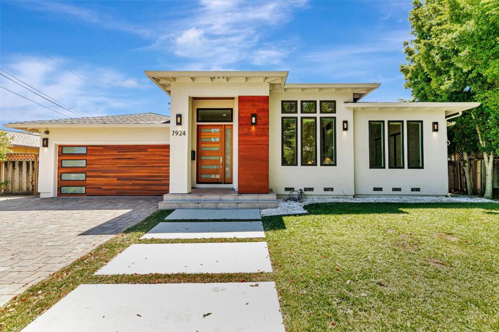 Custom-built in 2018, this stunning north-facing Cupertino home offers 4 bedrooms, 3.5 bathrooms, and 2,672 sq. ft. of modern living on a quiet cul-de-sac. The open floorplan features soaring ceilings, skylights, and expansive glass doors, complemented by a bonus office and mud room. The gourmet kitchen showcases European cabinetry, Miele appliances, and a multifunctional island that connects seamlessly to the family room and backyard deck. The primary suite includes a walk-in closet, double vanity, walk-in shower, and spa-inspired comforts such as a heated-seat Toto bidet and towel warmers, while bright bay windows enhance the secondary bedrooms. Modern upgrades include a 30-panel owned solar system, EV charger, Lutron lighting, Nest thermostat, integrated speakers with a 5-channel home theater system, and dual-zone central AC. Ideally located near Apple, shopping, dining, and top Cupertino schools-Monta Vista High, Kennedy Middle, and Lincoln Elementary.