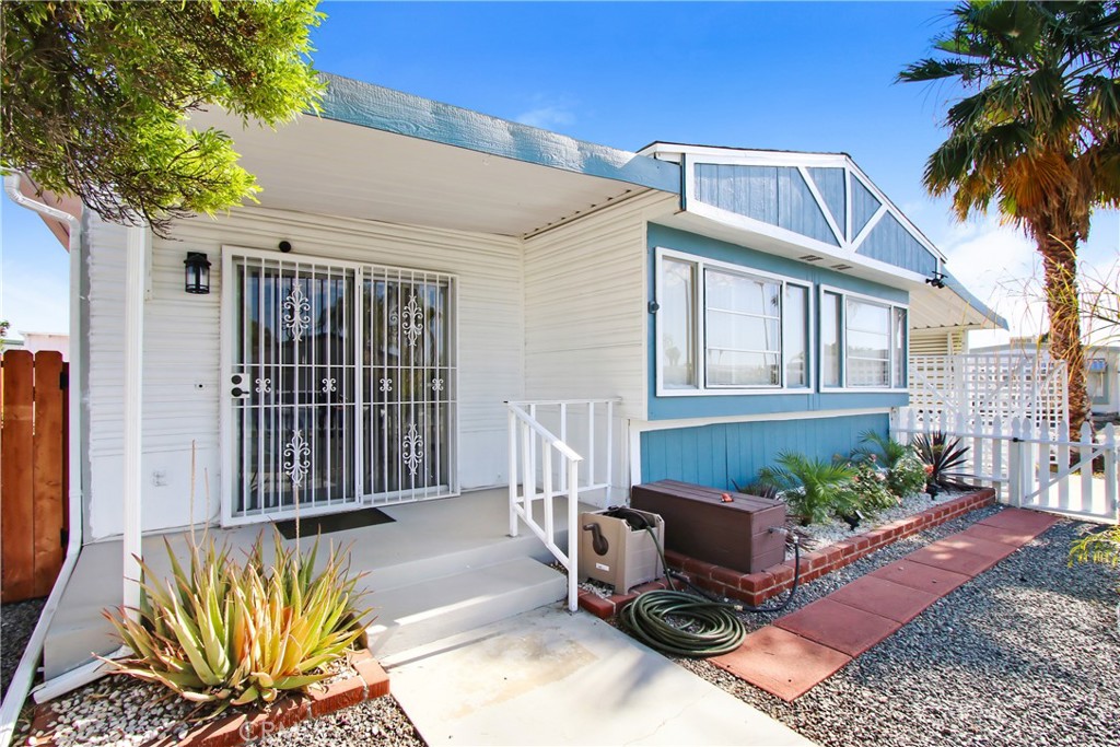 Charming 2-bedroom, 1-bath home with an open floor plan that has a huge inclosed sun room making it feel even larger! Situated on a spacious 4,356 sq. ft. all-usable lot in the highly desirable Sierra Dawn 55+ Community, this home was built in 1965 and has been beautifully updated for modern comfort and convenience. This gem features a new roof, central air and heat, and large picture windows that flood the living space with natural light. Inside, you’ll find waterproof laminate flooring, recessed lighting in kitchen area and ceiling fans in the living room and both bedrooms. The remodeled kitchen offers self-closing cabinets, granite countertops, stainless steel appliances, recess lighting and a bonus hutch with glass-front cabinets and under-cabinet lighting for additional storage and style. The outdoor space is equally impressive, with low-maintenance landscaping, a manual sprinkler system, a covered patio, and a long driveway that accommodates two cars and can close off for safety. There is also additional gated parking for a small RV or additional vehicle. The home also includes new gates and a white picket fence, a tool shed, and a dedicated outdoor washer/dryer area with storage. Living in the vibrant Sierra Dawn 55+ Community, you’ll enjoy access to four clubhouses, multiple pools, fitness rooms, a dance hall, and activity rooms, making it easy to meet new friends and embrace an active lifestyle. With no space rent and a low monthly HOA fee, this home offers an exceptional opportunity to enjoy resort-style living at its finest!
