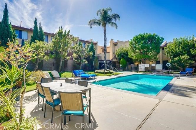 Bright and sun-filled, this remodeled 2-bed/2.5-bath townhome offers a large (1300 sq. ft.) floor plan with in-unit laundry and a private patio, ideal for relaxing mornings and entertaining at night. New appliances are supplied throughout. Upstairs, enjoy two large bedrooms, each with a full bath—a plus for roommates or a home office setup. Located in a quiet, gated complex with a pool and a jacuzzi. Extras include water and trash, and two assigned garage parking spaces. Just minutes from Warner Center, The Village, Westfield Topanga, Costco, and the 101 freeway. Move-in ready—schedule a tour! Rent includes HOA, water, and trash. Tenant to supply their own washer and dryer. No pets, please.