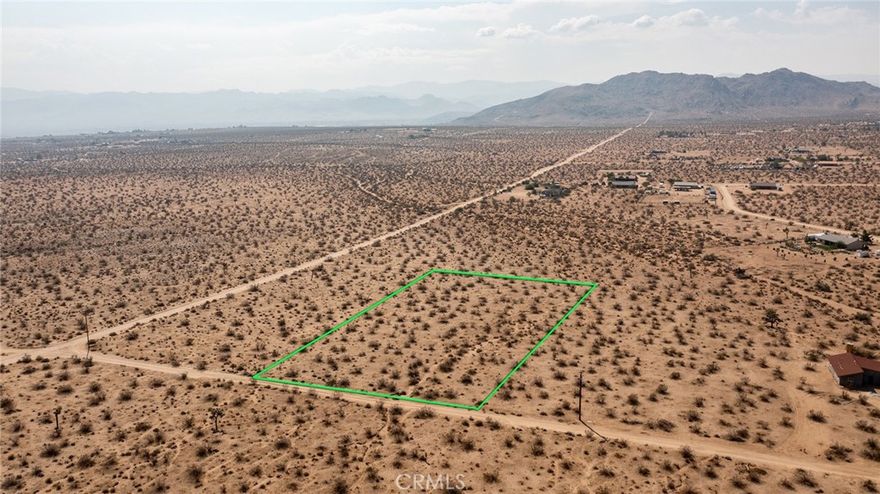 2.32-Acre Lot located in up-and-coming area of North Joshua Tree. Water & Electricity (utilities) nearby. Several new homes in the area. Great views from this elevated location. Rural. Surrounded by vast wilderness. Mountains nearby. Hiking. Fantastic sunrises to the east. NOTE: Green lines demarcating boundaries in pictures are approximate, as property has not been surveyed; street address is not official – do not use address or google map GPS to locate property. To find property, please locate with APN: 0599-501-08
