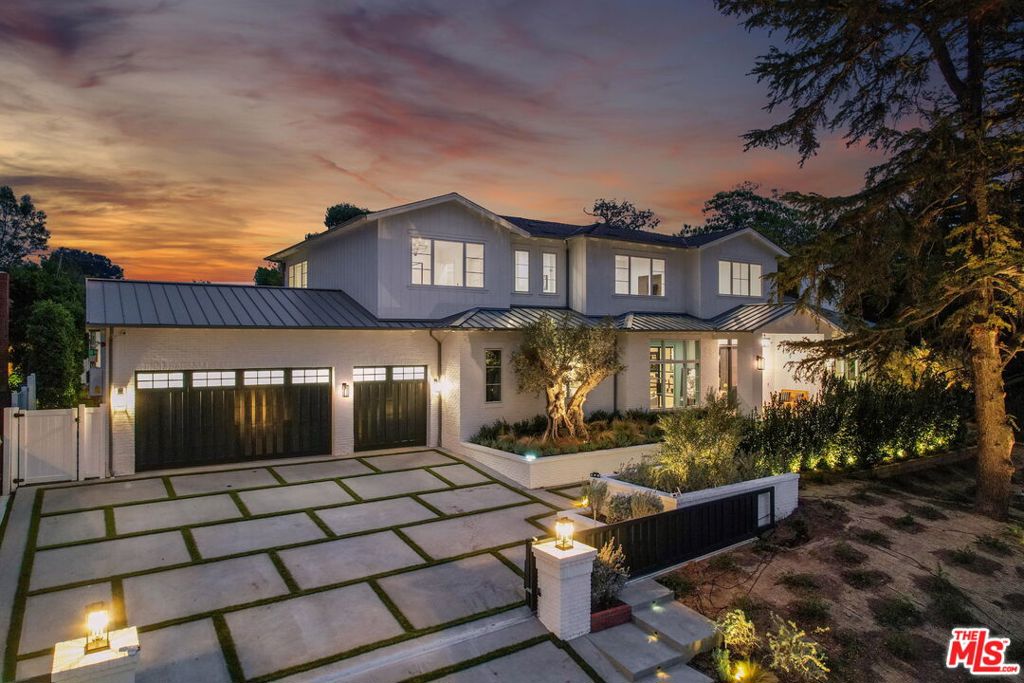 **SOLD BEFORE PROCESSING** Blending sophisticated East Coast style and modern California flair, this brand-new Brentwood home is a masterpiece of both design and function on a rare half-acre lot.