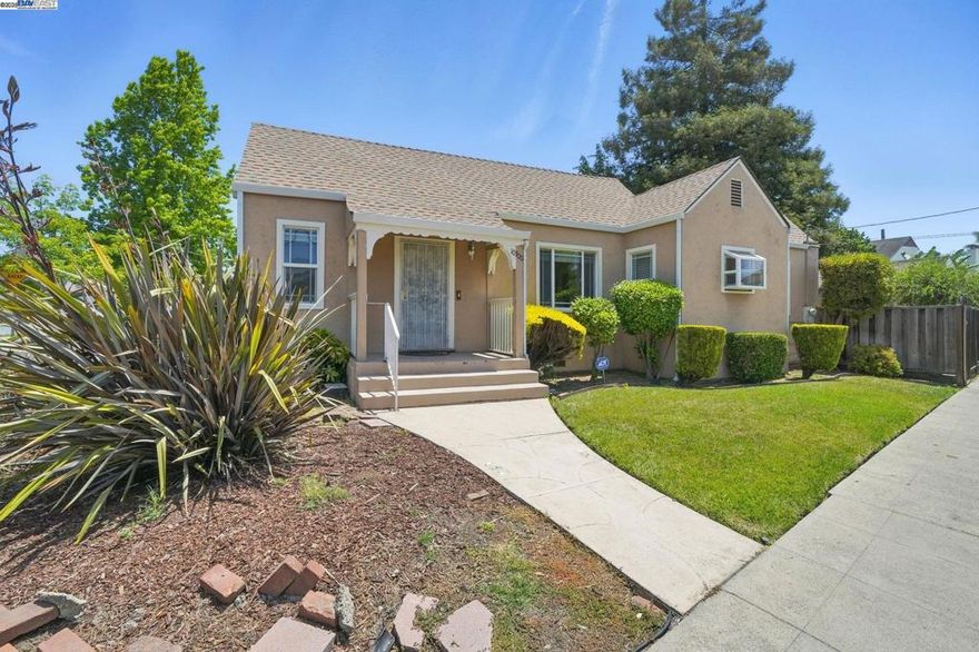 Situated near the Oakland–San Leandro border, this delightful 1935 home offers a perfect blend of character and functionality. With 2 bedrooms, 2 bathrooms, and a versatile office space, the layout provides both comfort and flexibility for today’s lifestyle.  An inviting open-concept living and dining area features elegant arched entryways and abundant natural light, creating a warm and welcoming atmosphere. The kitchen includes a cozy breakfast nook—perfect for morning coffee or casual meals. Both bathrooms offer thoughtful storage solutions, and vintage touches throughout the home nod to its historic roots.  Outside, enjoy a private backyard with a charming patio area and a detached garage with ADU potential (buyer to verify). Conveniently located just minutes from the San Leandro BART station, local shops, and dining, this home combines classic architecture with commuter-friendly access.