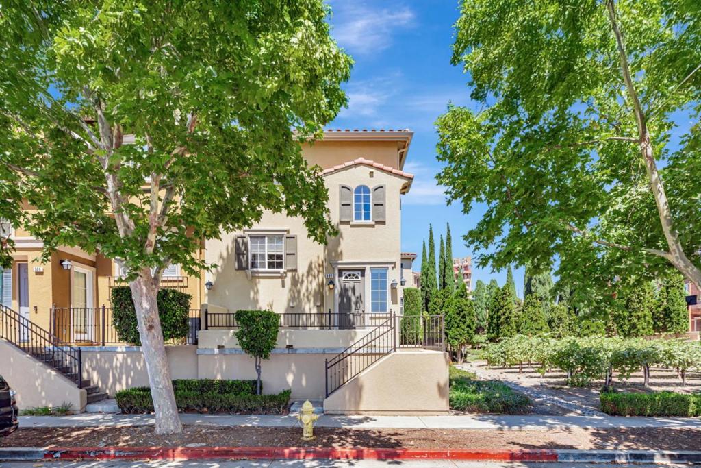 Expansive 2 bed, 2.5 bath end-unit townhome offering 1,777 sq ft of thoughtfully designed living space with sweeping views of the valley and city. Perfectly situated next to open space with a lush greenbelt and small vineyard, this home combines tranquility with convenience. The massive primary en-suite feels like two rooms in one, providing endless flexibility and comfort. Additional features include built-in audio surround sound, indoor laundry with a spacious utility room, and ample space ideal for a home office or creative retreat. Complete with an attached 2-car garage, this home blends function, comfort, privacy and breathtaking surroundings.