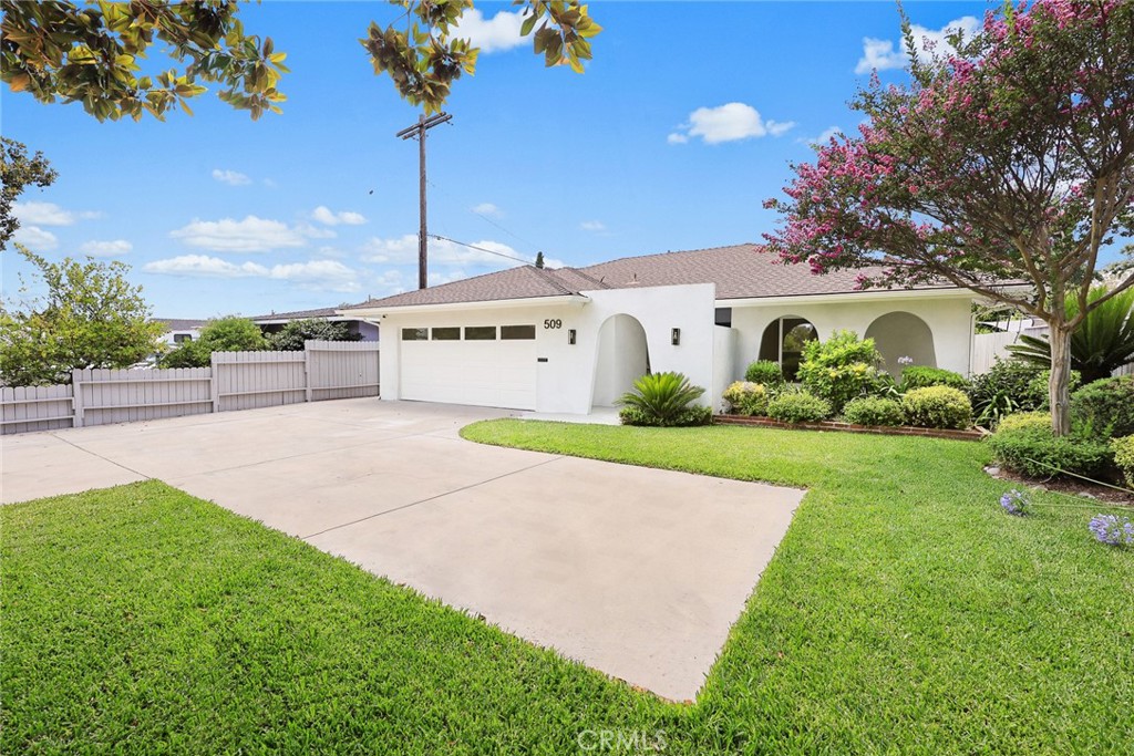 Tastefully updated single-story home near Hastings Ranch Plaza. The light-filled living room includes a gas fireplace and large picture windows overlooking lush landscaping. The gourmet kitchen boasts granite countertops, a large eat-in island, stainless steel appliances, designer backsplash, and custom cabinetry with pull-out trays. Down the hall are three bedrooms, including a spacious primary suite with backyard access and a stylish en suite bath with double sink vanity and makeup table. The hall bath is also outfitted with custom finishes. Upgrades include fresh interior and exterior paint, newer roof, Nest-controlled newer HVAC and ductwork, new-full house copper plumbing, new-laminate flooring and new double-pane windows throughout. A finished attached garage with direct access includes a laundry area and sleek new epoxy floors. Gather and relax in your private backyard with a patio, lawn, and new hedge for added privacy. Conveniently located near shops, cafes, and the Metro A Line, don't miss this opportunity!