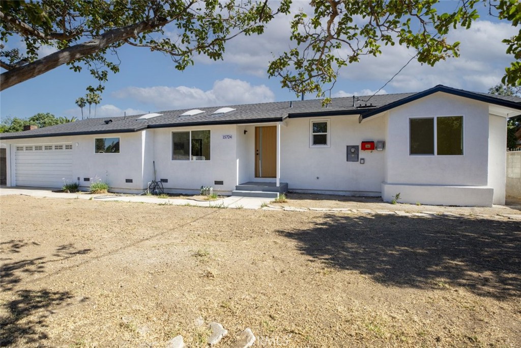 Welcome to 15724 Chase St in North Hills CA 91343. This beautifully remodeled single story home offers 3 bedrooms and 2 bathrooms across 1424 square feet of elegant living space on an oversized 18644 square foot lot. With modern finishes bright open living areas and exceptional outdoor space this home is a rare opportunity in a sought-after neighborhood. As you enter you are welcomed by a light-filled open concept floor plan that blends style and function. Large windows invite an abundance of natural light that fills the living and dining areas creating a warm and inviting atmosphere throughout. The updated kitchen features a spacious island ideal for cooking or entertaining a French door refrigerator quality appliances and generous cabinet storage for all your needs. Each of the three bedrooms is well-sized with thoughtful updates and the remodeled bathrooms feature modern finishes and clean design. Recessed lighting updated flooring and contemporary touches add to the home's turnkey appeal. In the back yard enjoy mature lemon trees and a vast open space perfect for entertaining relaxing or expanding. Whether you dream of gardening building an outdoor the possibilities are endless. The expansive lot also includes a durable metal carport or open-sided garage structure that offers flexibility for use. It can serve as a workshop storage for equipment or vehicles a utility shed or shelter for tools and supplies. The property includes an attached 2 car garage and an in-home laundry area with washer and dryer for added convenience. Located on a quiet residential street with close access to schools shopping dining and freeways this home offers the perfect balance of privacy and accessibility. This is your chance to own a fully upgraded home with a rare lot size and space to live grow and create. Schedule your private tour today.