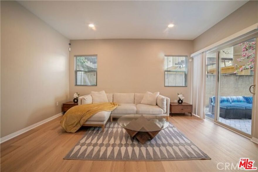 Beautifully Renovated Turnkey Three-level Single-family home featuring an open kitchen with granite countertops and stainless-steel appliances, dining room, living area on the First floor with direct access to a private patio and pergola - perfect for family gatherings. The Second floor offers two spacious bedrooms, a full bath, a secondary living area, and a laundry room. The Third floor is dedicated to a private primary suite with its own bathroom. The property includes attached one-car garage and three additional parking spaces. High-end restaurants and shops are opening next door. Close to schools, shops and transportation. Move-in ready. No sign on property. Seller motivated.