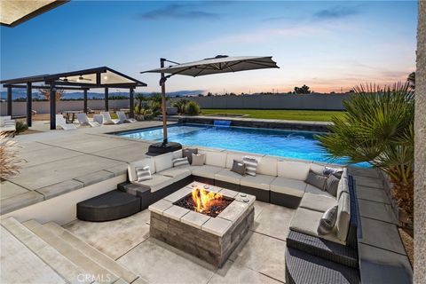 Photo of 9817 Silver Palm Dr, Oak Hills, CA 92344 (MLS # HD25272224)