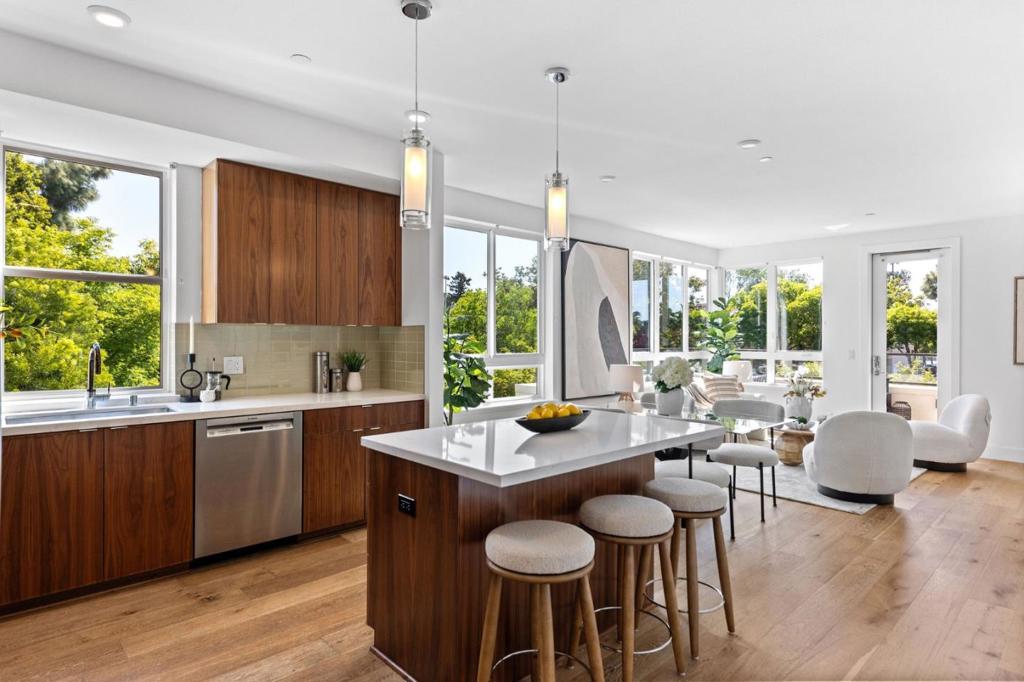 Stylishly Updated Condo with Balcony Views in Prime Mountain View Location Step into 1101 W El Camino Real #219 a rare opportunity to own a modern, updated 1-bedroom, 1.5-bath condo in one of Mountain Views most desirable communities. This bright, second-floor unit features an open-concept layout with large windows and a private balcony offering serene outdoor views perfect for your morning coffee or unwinding at sunset. The chef-inspired kitchen boasts stainless steel appliances, a double-door refrigerator, quartz countertops, ample cabinetry, and a center island that opens to the dining area. The spacious living room invites natural light, creating a warm, airy ambiance. Retreat to the generous bedroom with a walk-in closet and a luxuriously upgraded ensuite bath with dual sinks and sleek finishes. Additional highlights include an in-unit washer/dryer, reserved parking, and a private storage unit. Enjoy resort-style living with a welcoming lobby, secure mail room, dog park, and a chic outdoor lounge with BBQ area. Just minutes from downtown Mountain View, Castro Street, Caltrain, Google, LinkedIn, and major highways. Modern living meets unmatched convenience.