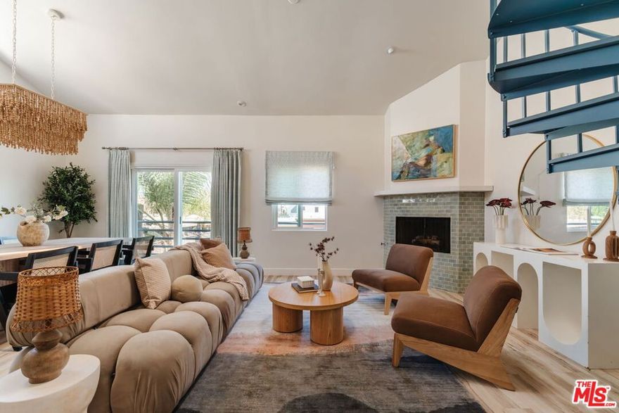 Located just 3 blocks from the beach, this elegantly remodeled 3-bedroom front facing unit, designed by Santa Monica based interior designer Christine Markatos, is located on the coveted Marina del Rey Peninsula. Contained in a boutique 2-unit building and boasting low HOA dues, coastal breezes, ocean views, and an abundance of natural light. The focal point of the home lies within its spacious dining area and generously sized living room complete with a gas fireplace, balcony and high vaulted ceilings throughout. The updated gourmet kitchen features calcutta quartz countertops, stainless steel appliances, custom cabinetry, and a generous center island. Ascend the elegant spiral staircase to find a versatile study/ media room with access to a private two-level outdoor deck, perfect for soaking in the coastal ambiance or watching the sunset. The primary bedroom offers a generous walk-in closet, glass sliding doors opening onto a balcony, en-suite bathroom with dual vanity sinks, oversized shower and ample storage. Two additional suites well-appointed for a guest-room or home office. The lower level features a private two-car garage with direct access to a versatile flex space. This multifunctional area is thoughtfully equipped with a convenient kitchenette and a well-appointed bathroom, enhancing both comfort and functionality. Outside, the gated front courtyard presents an inviting atmosphere, complete with an outdoor shower and abundant seating arrangements, ensuring ample space for relaxation and socializing. Exceptional location with incredible proximity to local restaurants, shops, theaters, and the beach. A true gem in the heart of one of L.A.'s most dynamic enclaves. Within the excellent Coeur D'Alene primary school district.