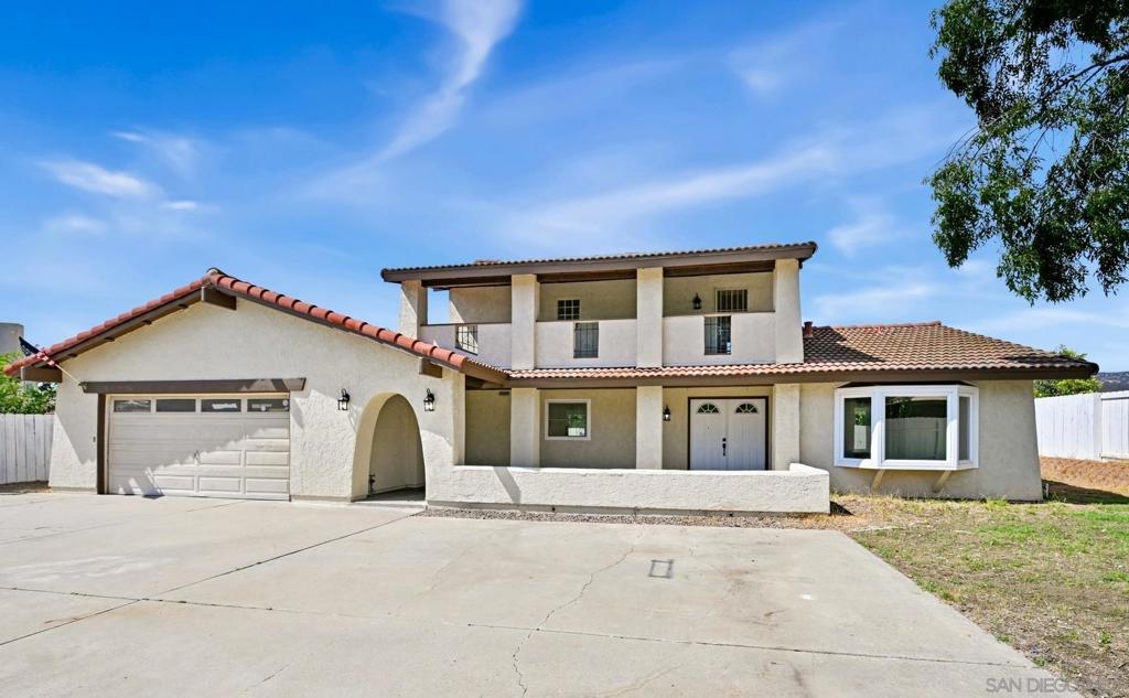 Welcome to your dream home in San Marcos! Tucked away on a premium 10,039 sq. ft. flag lot, this gated and fully fenced property offers privacy with ample space for RVs, boats, and all your toys. This exceptional home blends a premium location, modern elegance and suburban serenity. Take in the mesmerizing mountain views and sunsets! The upper and lower patios are perfect settings for relaxing, entertaining, or dining al fresco. Inside, recent upgrades shine with owned solar panels, brand-new LVP flooring downstairs and in the primary suite, and a beautifully renovated kitchen featuring a 6-burner stove for those home chefs, double drawer dishwasher to assist in clean-up, quartz countertops, floating shelves, decorative tile backsplash, and modern accents that seamlessly connect to the dining area. The inviting living room boasts a fireplace with granite and subway tile surround, complemented by new recessed lighting. The grand primary suite includes a walk-in closet and a newly renovated, spa-like ensuite bathroom with a walk-in shower, quartz-topped vanity, and a dedicated space ideal for a makeup station. All four bedrooms are generously sized, with two conveniently located on the first floor—one showcasing a charming window seat. These rooms share a full bath accented with stone flooring and wainscoting. With close proximity to parks, shopping, dining, and top-rated schools, this home effortlessly blends comfort, style, and convenience. This generous lot provides limitless potential, imagine a pool, ADU or pickleball set up. Welcome home!
