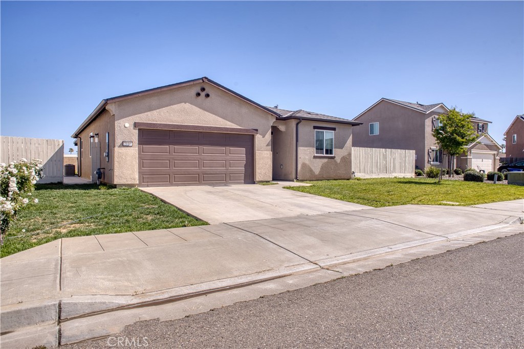 Welcome to this beautifully maintained single-story home featuring 3 spacious bedrooms, 2 full bathrooms, and an extra bonus room that can easily serve as a home office, guest bedroom, or hobby space perfect for flexible living. The semi-open concept kitchen and living area is ideal for gatherings, offering a warm and inviting layout with granite countertops, quality finishes, and a seamless flow for entertaining guests or enjoying family time. Energy efficiency is a highlight with owned solar panels, helping to keep utility costs low year-round. Step outside to a covered patio with concrete flooring, ideal for relaxing or hosting BBQs, and enjoy the added value of installed rain gutters for enhanced exterior care. Additional features include a two-car garage, modern fixtures throughout, and a great location with convenient access to schools, shopping, and parks. Built just three years ago, this home boasts numerous upgrades thoughtfully made by the current owners, who had originally planned to stay long-term but are now relocating out of state for work. This home combines comfort, practicality, and smart investments ready for its next owners to enjoy.