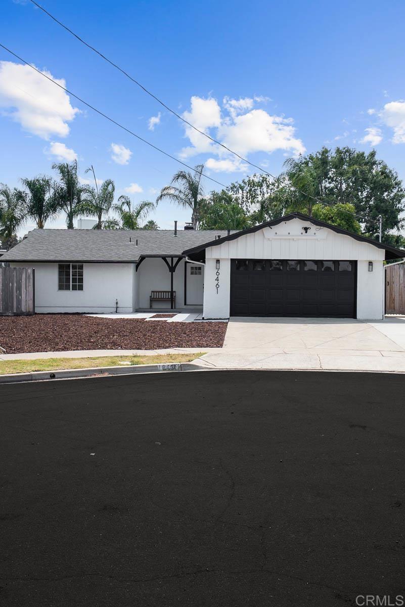 PAID-OFF SOLAR SYSTEM INCLUDED! Welcome to this stunning, fully remodeled 3-bedroom, 2-bathroom home, Situated on a generous .27-acre lot, ideally located in a peaceful cul-de-sac perfect for families seeking space, comfort, and modern convenience. The home features a long list of high-quality upgrades, including a new roof, new HVAC system, luxury vinyl plank flooring, and a fully fenced yard with brand-new turf, offering a safe, low-maintenance outdoor space perfect for kids and pets. Step inside to a bright, open floor plan filled with contemporary finishes. The beautifully updated kitchen boasts new cabinetry, quartz countertops, a stylish accent backsplash, a spacious island with bar seating, and brand-new stainless steel appliances ideal for both family dinners and entertaining guests. Additional modern conveniences include energy-efficient solar (PAID OFF), an upgraded electrical panel, and a Tesla EV charger in the garage—providing eco-friendly, future-ready living. A cozy living room with a fireplace sets the stage for relaxing family time or quiet evenings. Both bathrooms have been stylishly remodeled with modern vanities, sleek fixtures, and high-end finishes, delivering a clean, spa-like atmosphere. This move-in-ready home is just steps from Pershing Middle School, Gage Elementary, and the Mission Trails Little League fields, all within one of San Carlos’s most desirable neighborhoods. Enjoy unbeatable access to the San Carlos Rec Center, Mission Trails Golf Course, scenic hiking trails, Lake Murray, Grossmont Center Mall, and major freeways including the 125.