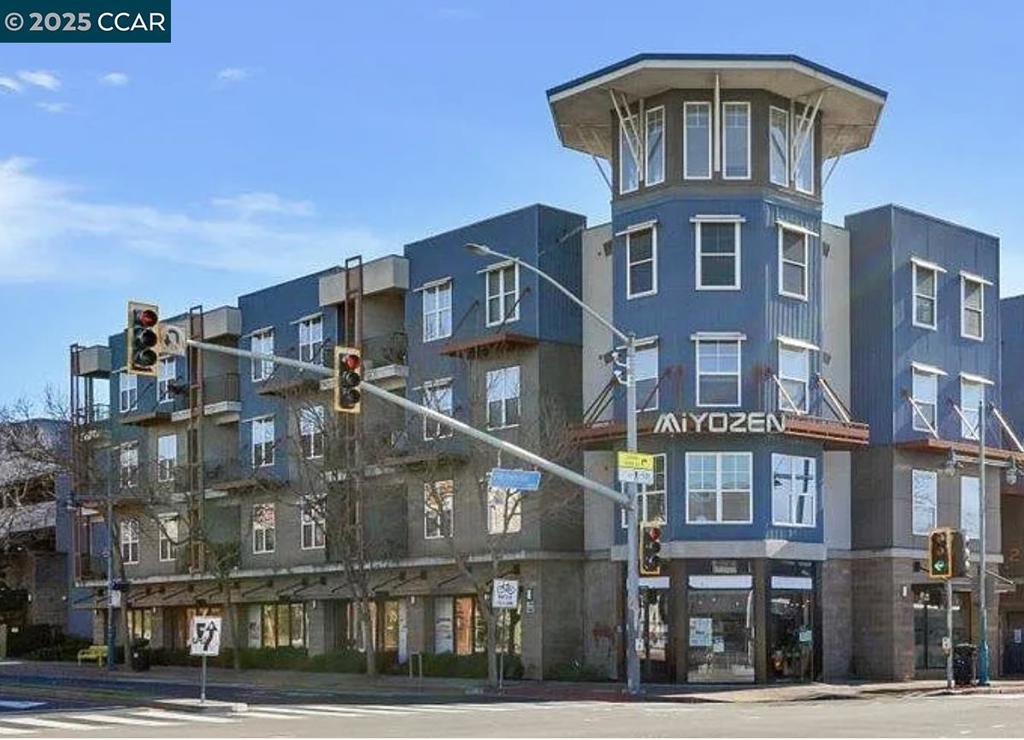 This stylish and spacious 2-bedroom, 2-bath condo is located in a modern building in the heart of Emeryville. Just a short walk to MacArthur BART or the free Emery-Go-Round shuttle, with direct service to the Salesforce Transit Center, it offers excellent public transportation options and easy access to Oakland, San Francisco, Berkeley, and major freeways. Freshly painted, the unit features granite countertops, stainless steel appliances, laminate flooring in the main areas, and carpeted bedrooms. The main bedroom includes a private bathroom with a separate sink area, while the second bedroom offers its own vanity and access to the second full bath. Both bedrooms have walk-in closets. Additional amenities include an in-unit washer/dryer, a private storage room, two secured garage parking spaces, and access to a fitness center and outdoor hot tub. Conveniently located near Safeway, Trader Joe’s, parks, coffee shops, and more, this home has a Walk Score of 85 – Very Walkable.